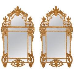 Two large Régence style carved giltwood wall mirrors 