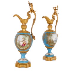 Two Large Rococo Style Porcelain and Gilt Bronze Jugs