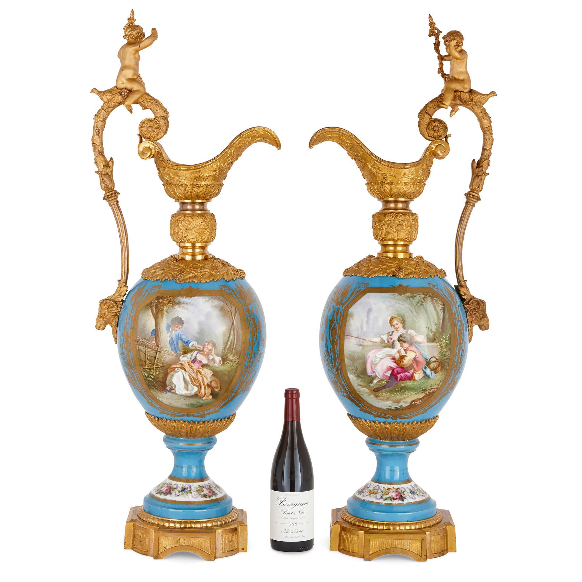 French Two Large Rococo Style Porcelain and Gilt Bronze Jugs For Sale