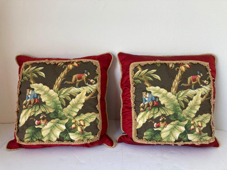 Two large vintage throw pillows with tropical jungle monkeys playing in coconut palm tree print design.
Pair of Venetian style pillows with monkeys banana jungle print backed with red silk, zipper down pillow insert.
Excellent like new condition.