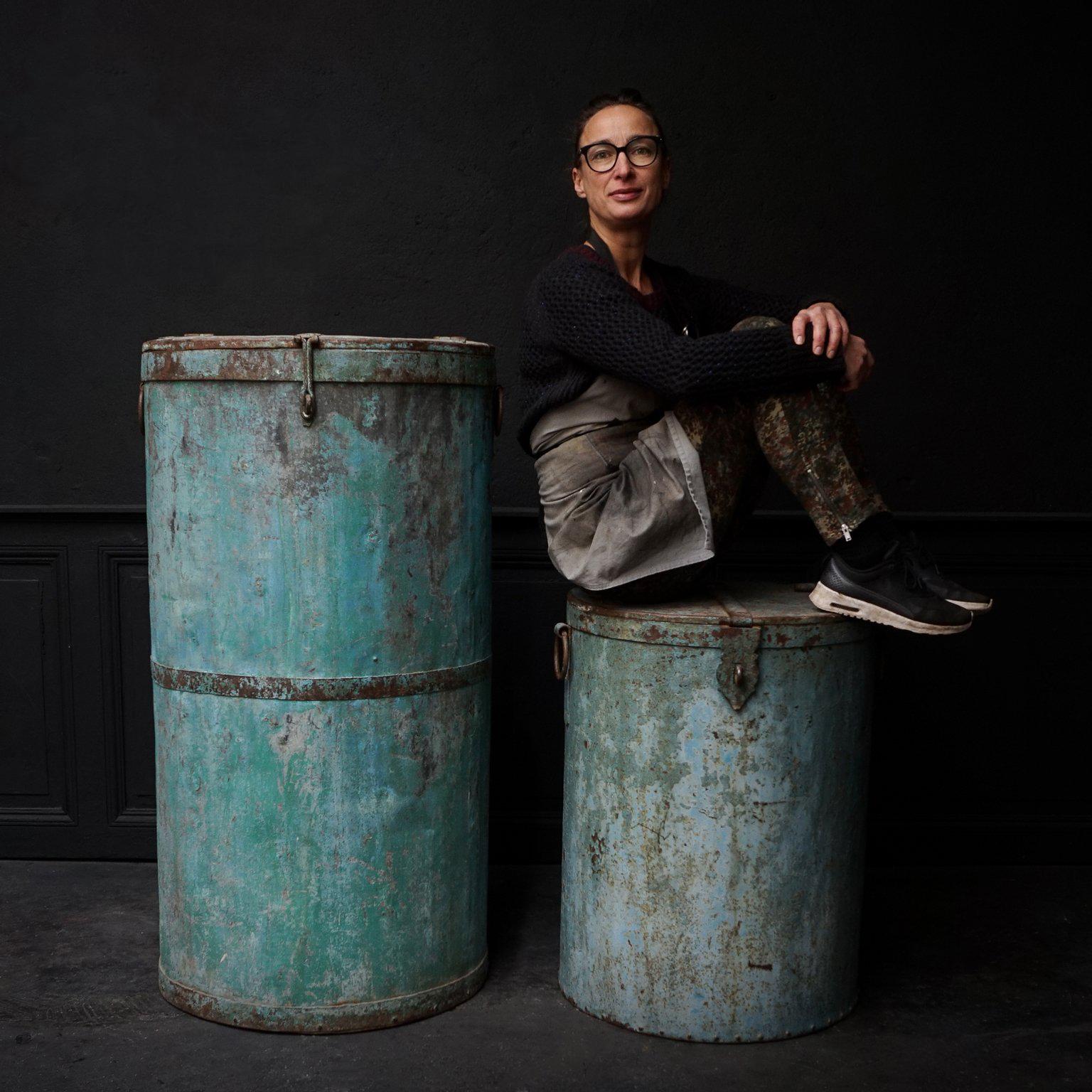 Beautiful Industrial metal barrels or drums with hinged lids.
Not quit sure what they were used for, probably for any kind of dry goods that had to be stored.
This old turquoise rustic worn metal patine color is perfect. You could use them as high