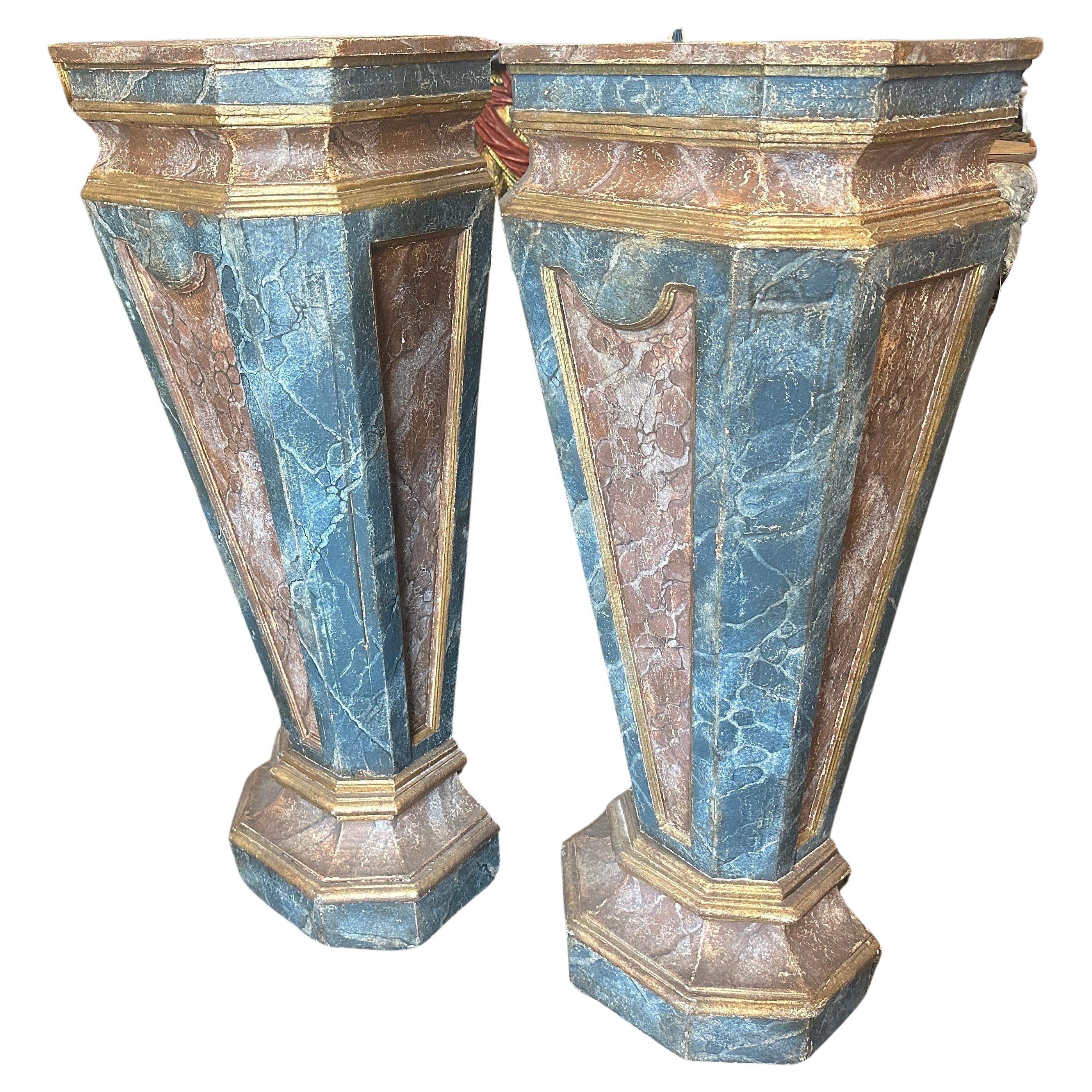 Two Blue, brown and gold lacquered wood columns hand-crafted in Italy in late 19th century, they were in a noble Sicilian palace at the four corners of a large hall, there are 4 columns available and they are sold in pairs. They exhibit
