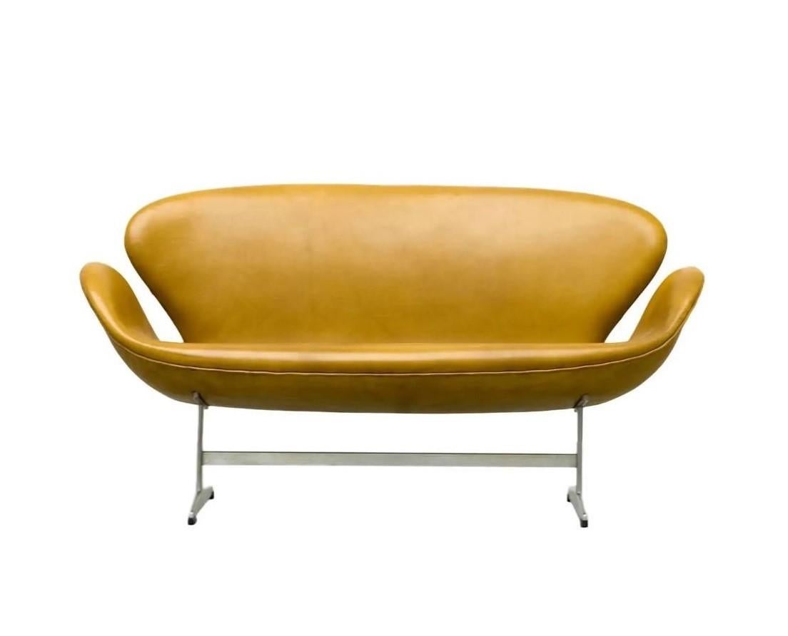 Easily one of Arne Jacobsen's most recognizable designs is the rare 'Swan' settee model no. 3321, for The Republic of Fritz Hansen. Devised as an extension and produced in far fewer numbers than the famous Swan chair. The settee is a sculptural