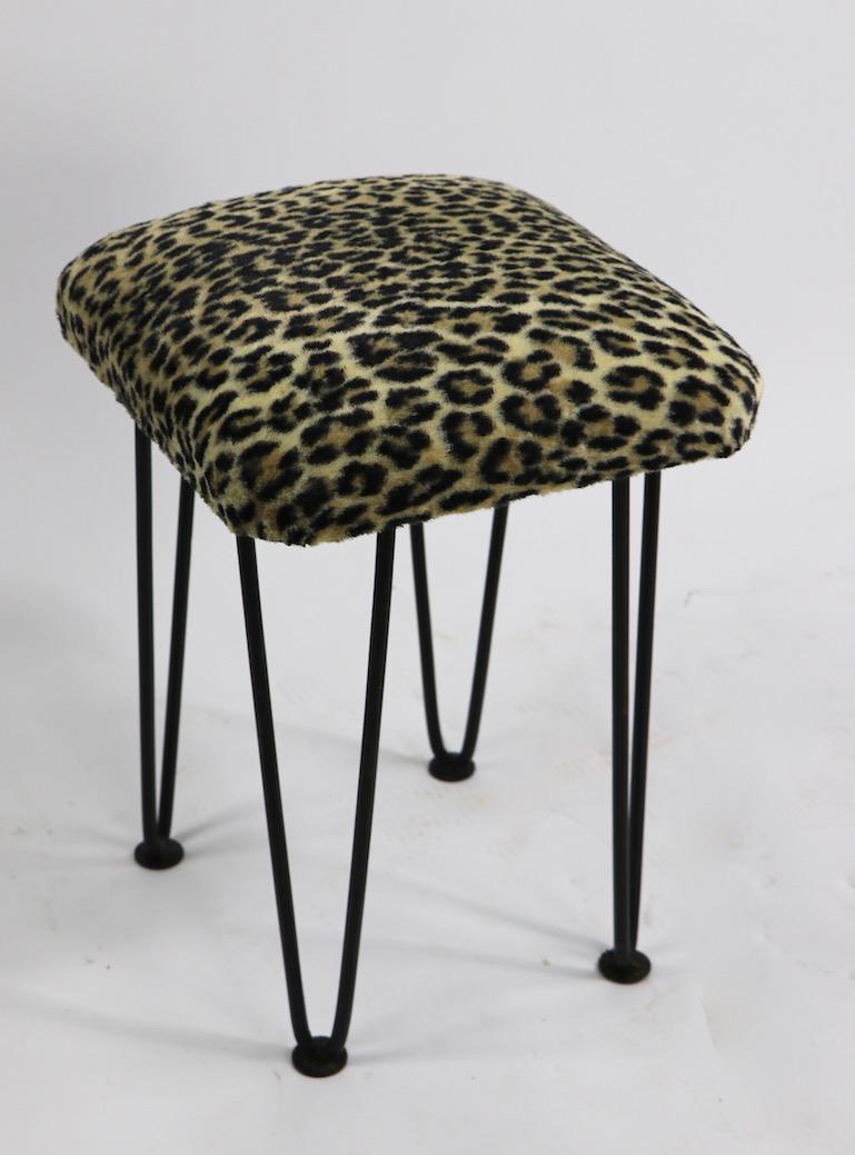Chic stylish upholstered stools on wrought iron hairpin legs. Offered and priced individually, but we would love to see them stay together.