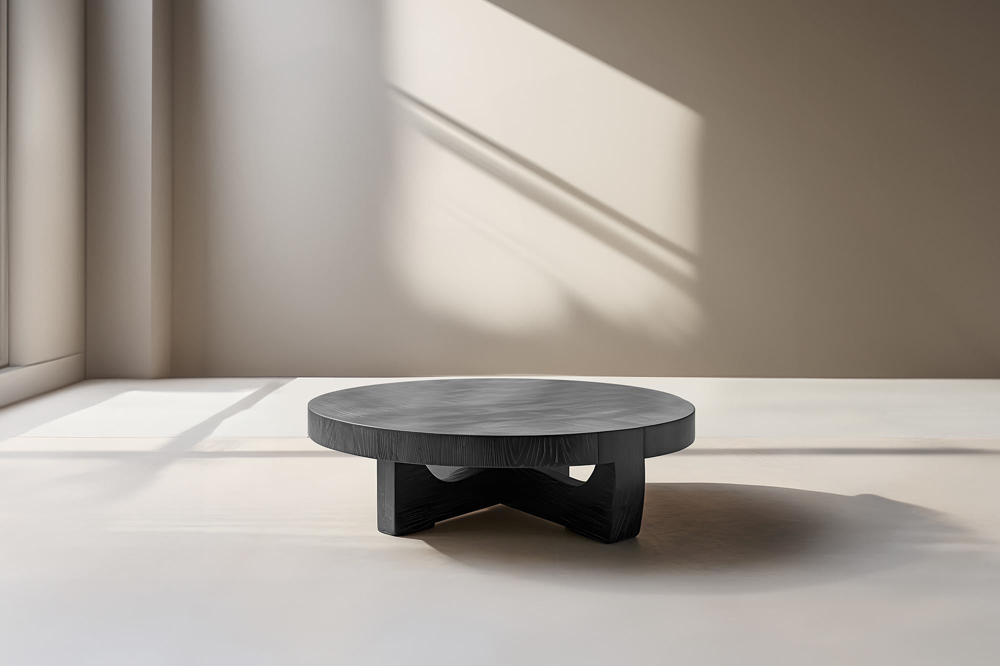 Two-Level Round Coffee Table - Layered Fundamenta 40 by NONO

Sculptural coffee table made of solid wood with a natural water-based or black tinted finish. Due to the nature of the production process, each piece may vary in grain, texture, shape or