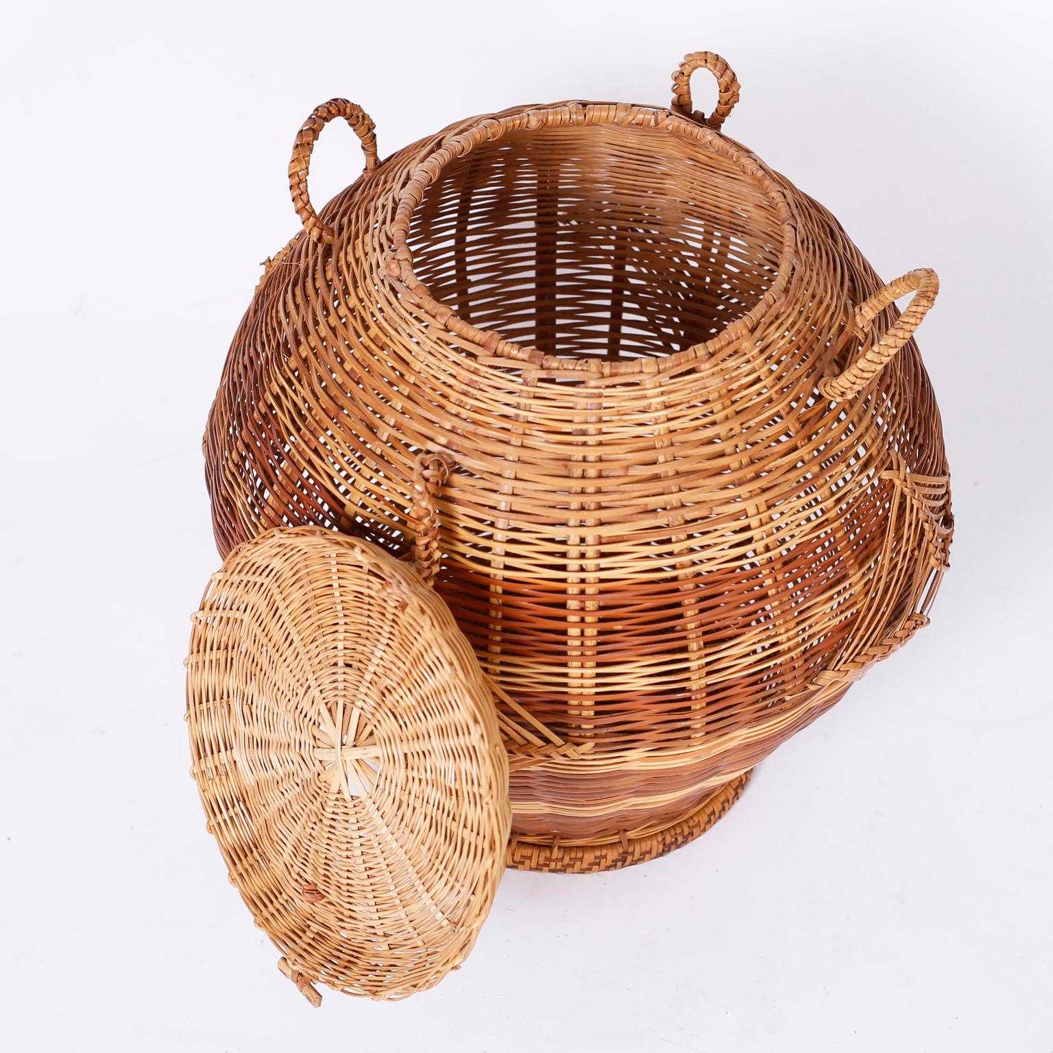 Two Lidded Wicker Baskets, Priced Individually In Good Condition In Palm Beach, FL