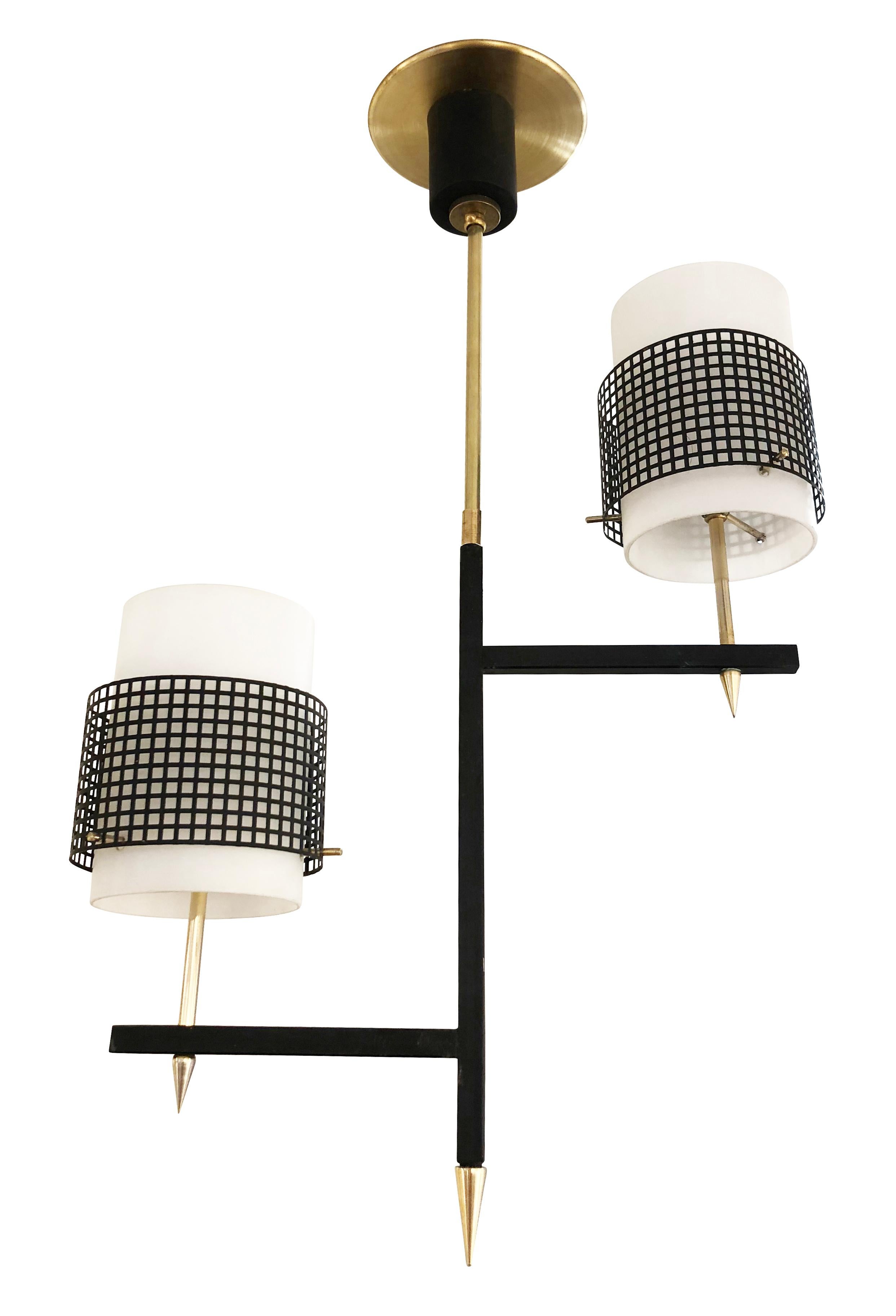 Italian midcentury pendant with two staggered frosted glass shades decorated with a black metal mesh. Brass details. Holds two candelabra sockets.

Condition: Excellent vintage condition, minor wear consistent with age and use

Measures: Width