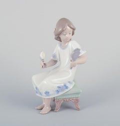 Two Lladro porcelain figurines of young women. Approx. 1980s
