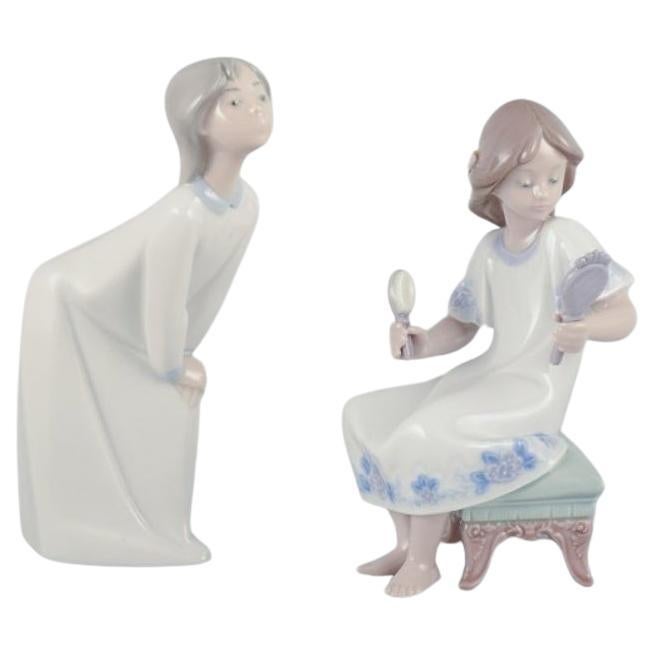 Two Lladro porcelain figurines of young women. Approx. 1980s For Sale