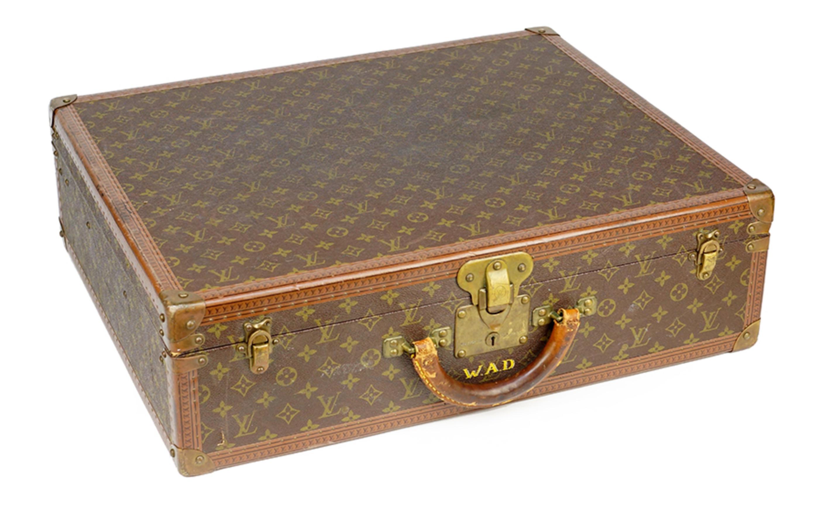 Two Louis Vuitton suit cases priced per suit case.