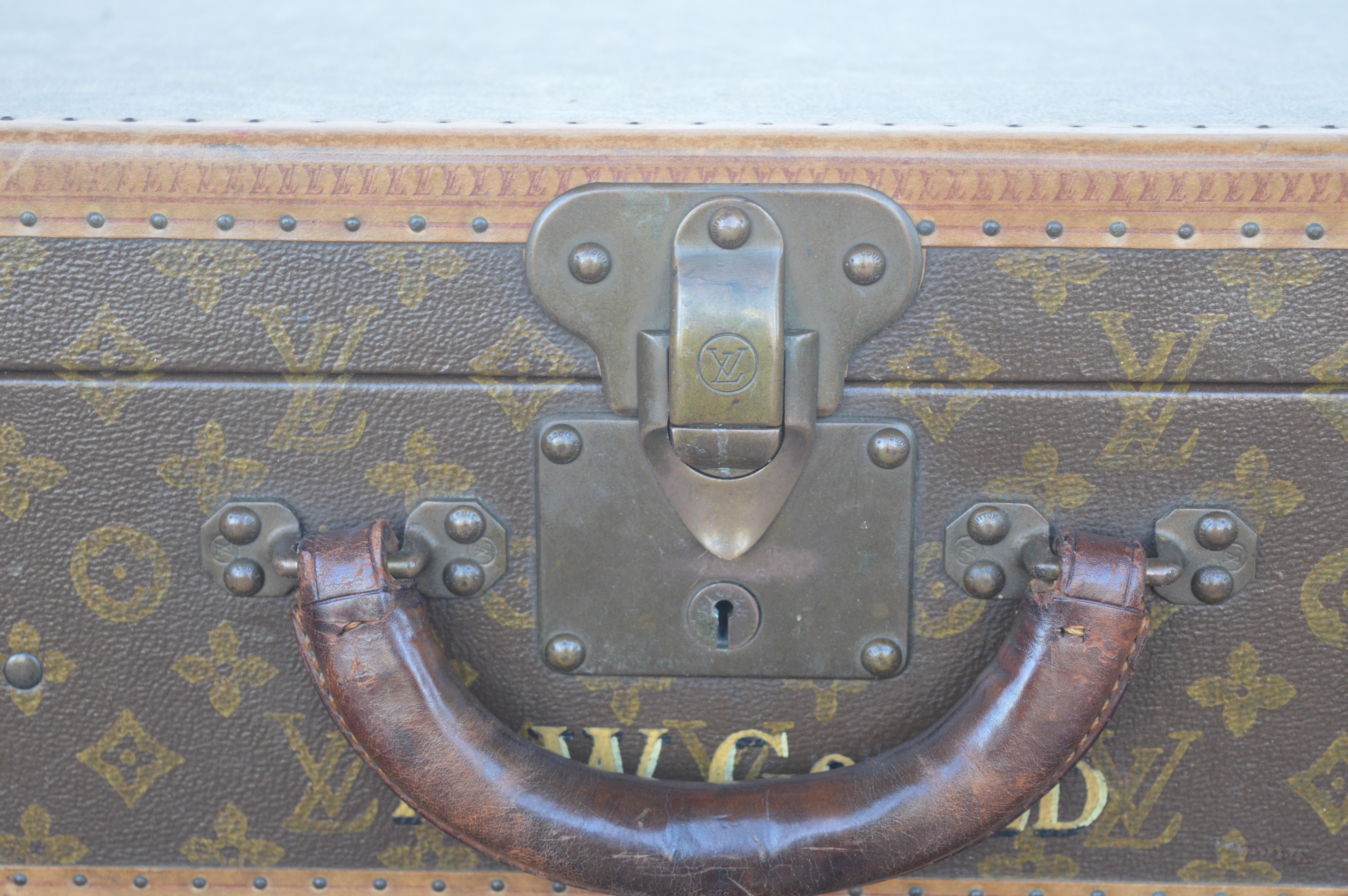 Two Louis Vuitton trunks.
Smaller one measures 14.5 inches H x 23.5 inches W x 7 inches D.