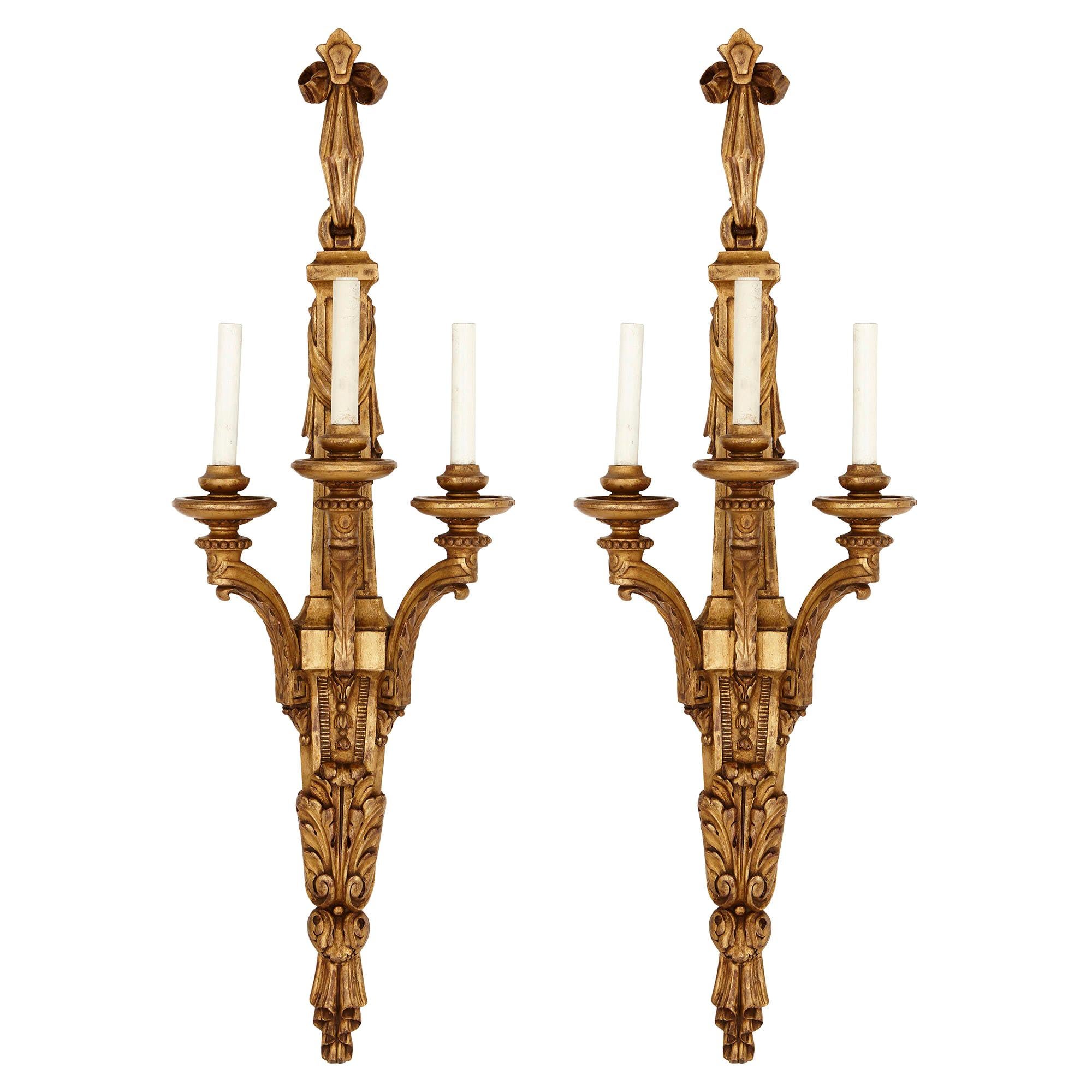 Two Louis XVI Style Carved Giltwood Wall Sconces For Sale