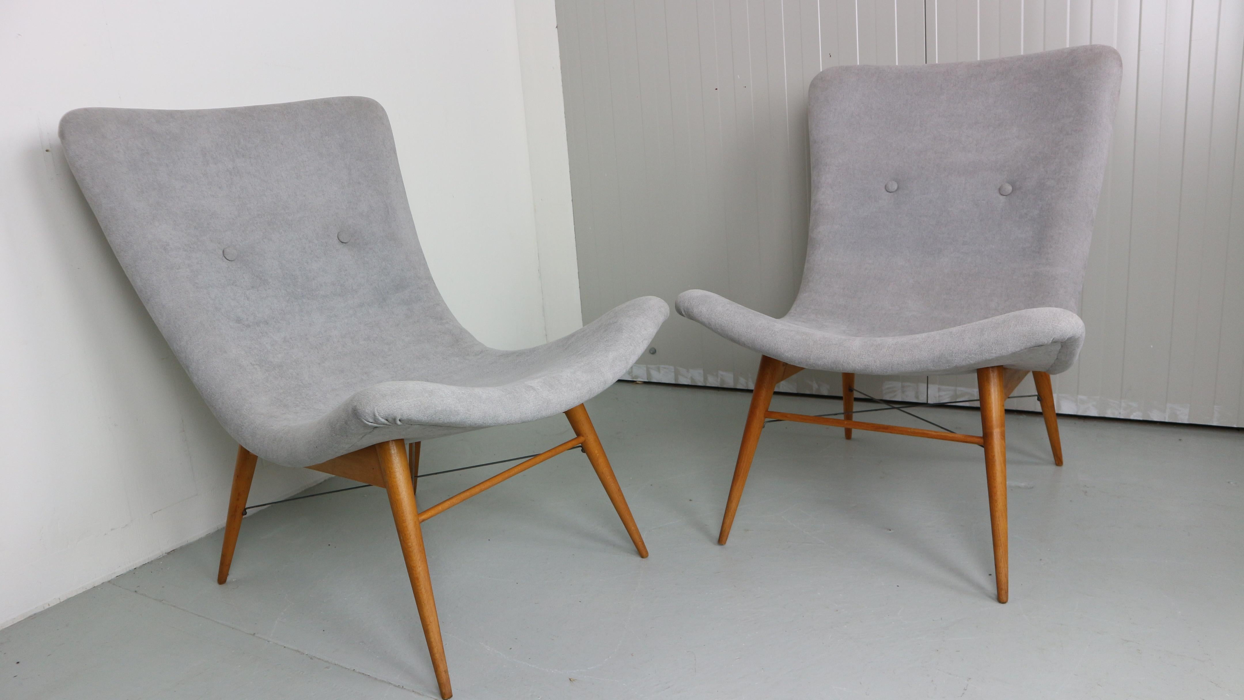 Set of two lounge chairs by Miroslav Navratil, manufactured in former Czechoslovakia by Cesky Nabytek, 1959s.
Original wooden base.
Both chairs have been newly reupholstered with light gray fabric. 