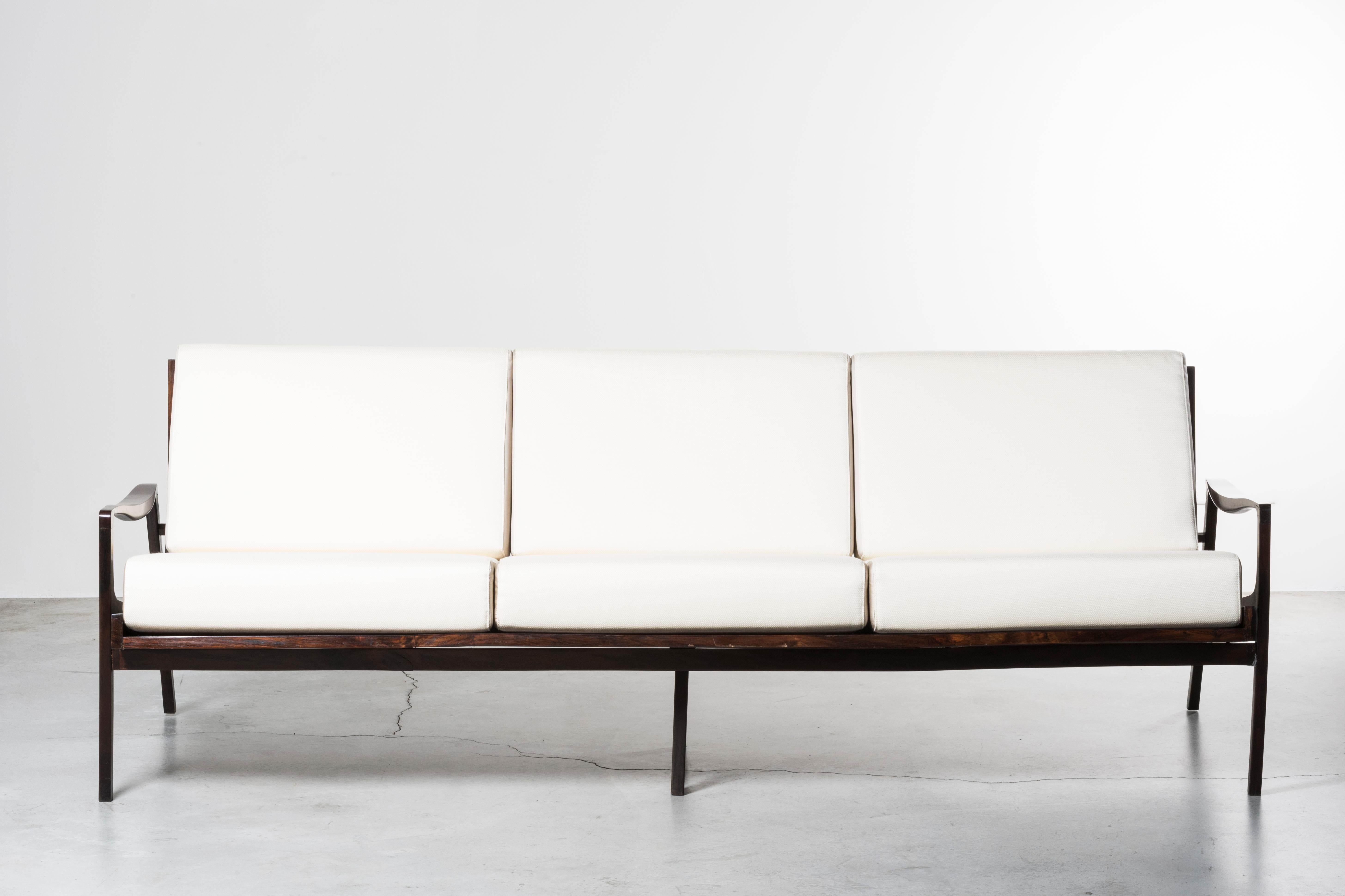Lounge sofa
Brazil, 1958
Manufactured by Lyc¸eu de Artes e Officios
Brazilian ironwood, fabric upholstery

220 x 90 x H 70 H seat 45 cm
86.6 x 35.4 x H 27.5 H seat 17.7 in

Please note: Prices do not include VAT. 
VAT may be applied depending on the