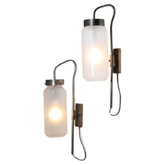 Two Luigi Caccia Dominioni Italian sconces in glass and patinated brass