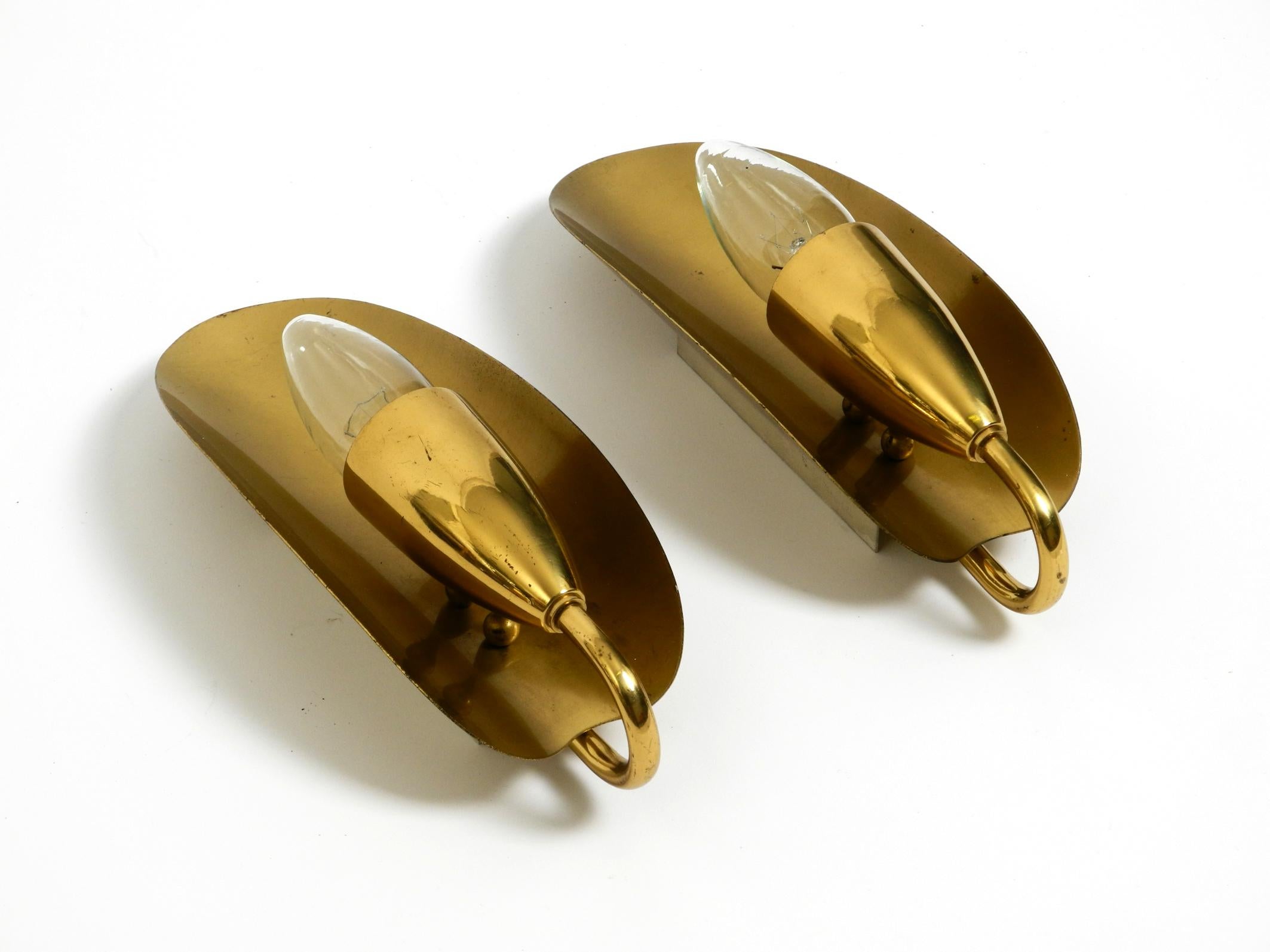 Mid-Century Modern Two magical original Mid Century Modern bag brass wall lamps