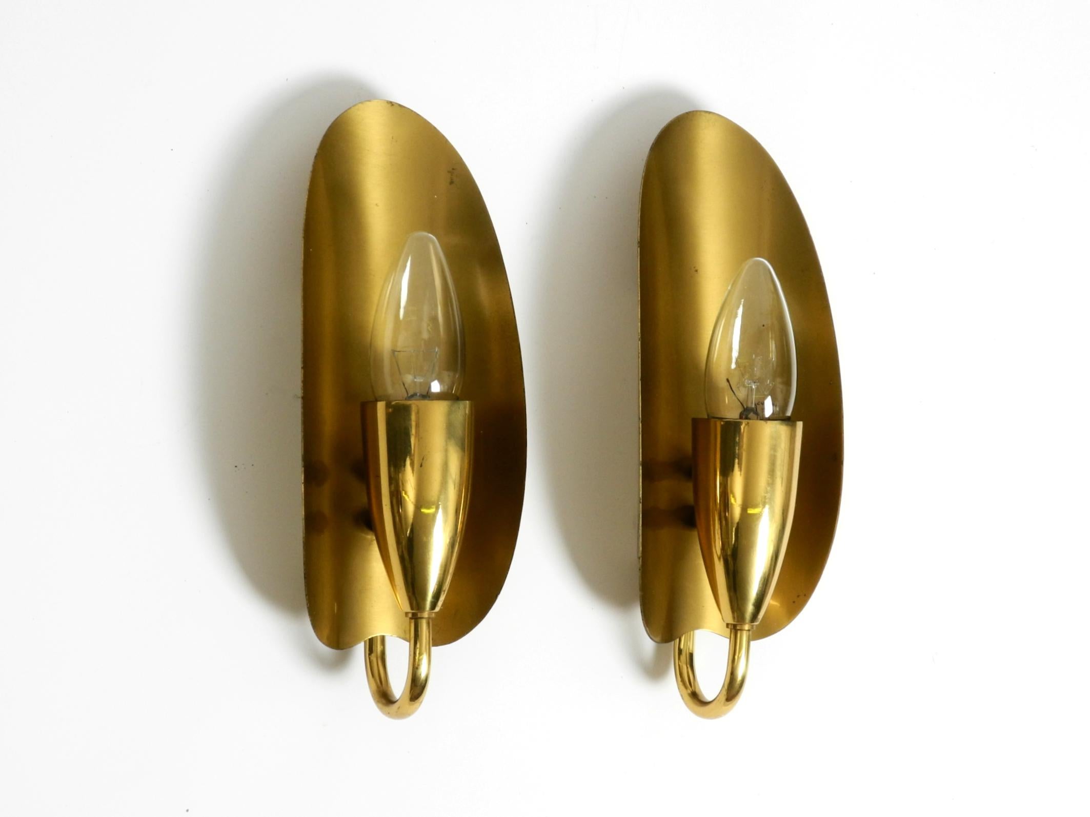 German Two magical original Mid Century Modern bag brass wall lamps