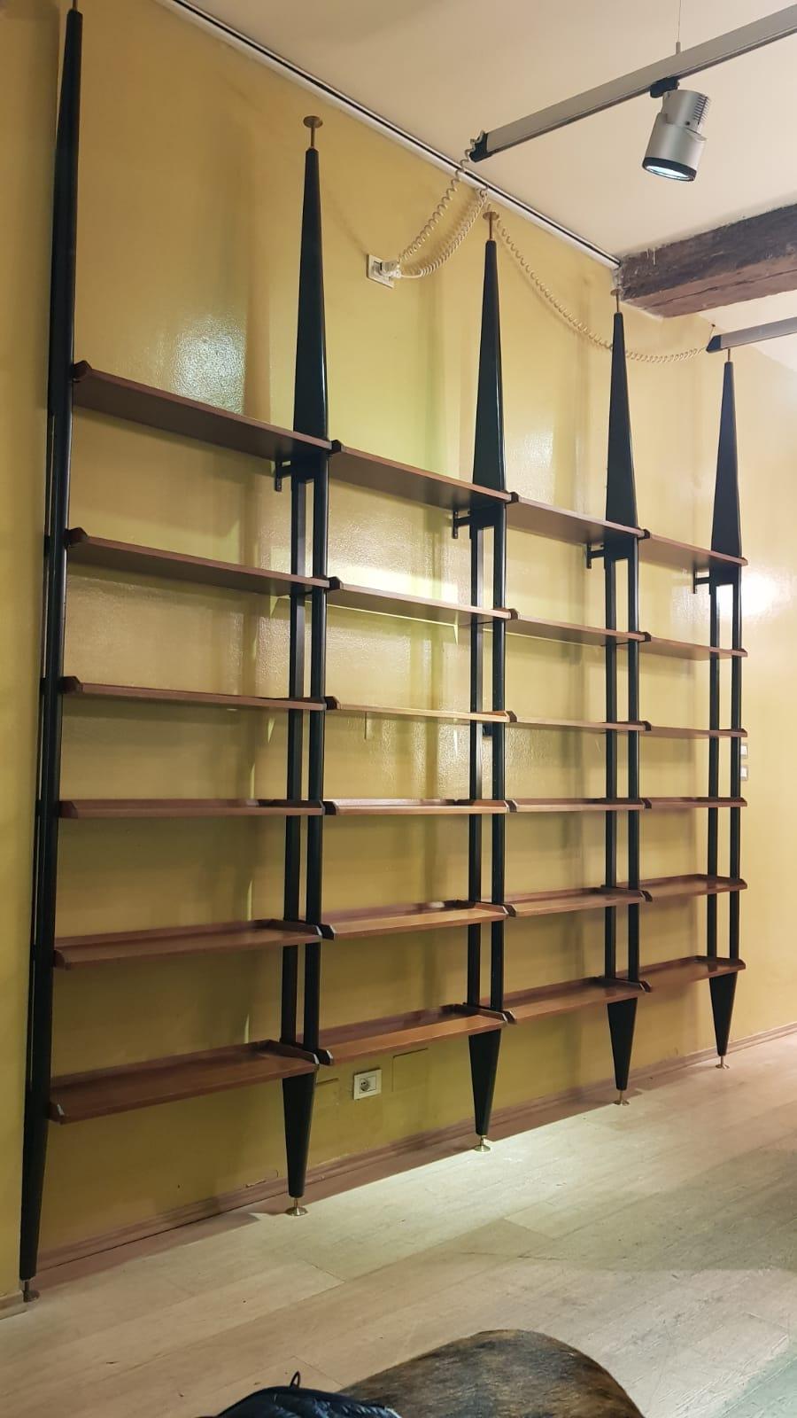Two mahogany wood adjustable shelves black metal Uprights, Albini's style. Bookcases, from Italy from 1950s period. The bookcases come from one bigger original structure (still available and possible) see pictures.
Appreciable for its size, it is