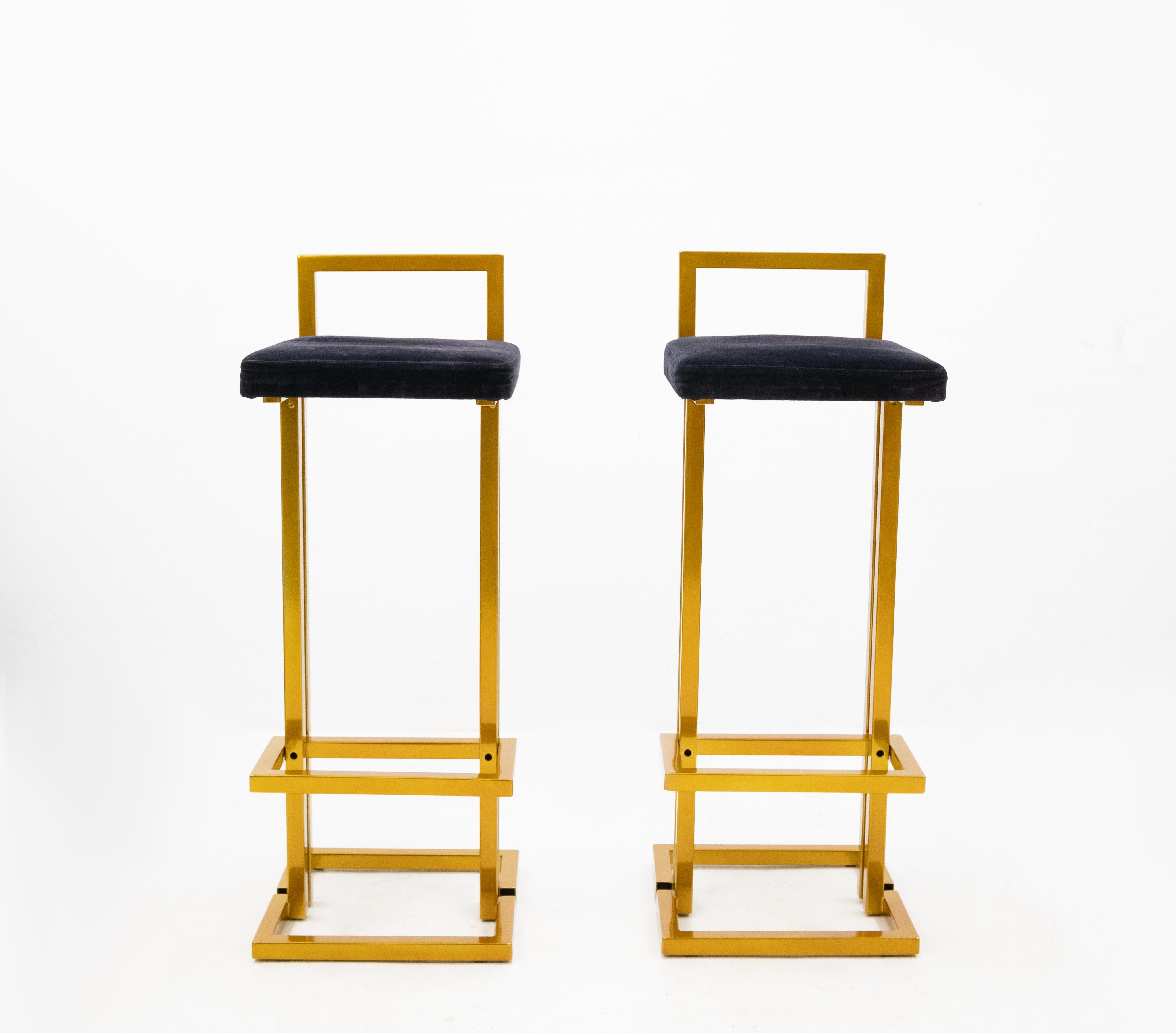 Two original Maison Jansen bar stools. Refinish in a gold color powder coating.
Comes with a blue velvet upholstery. Very good condition.