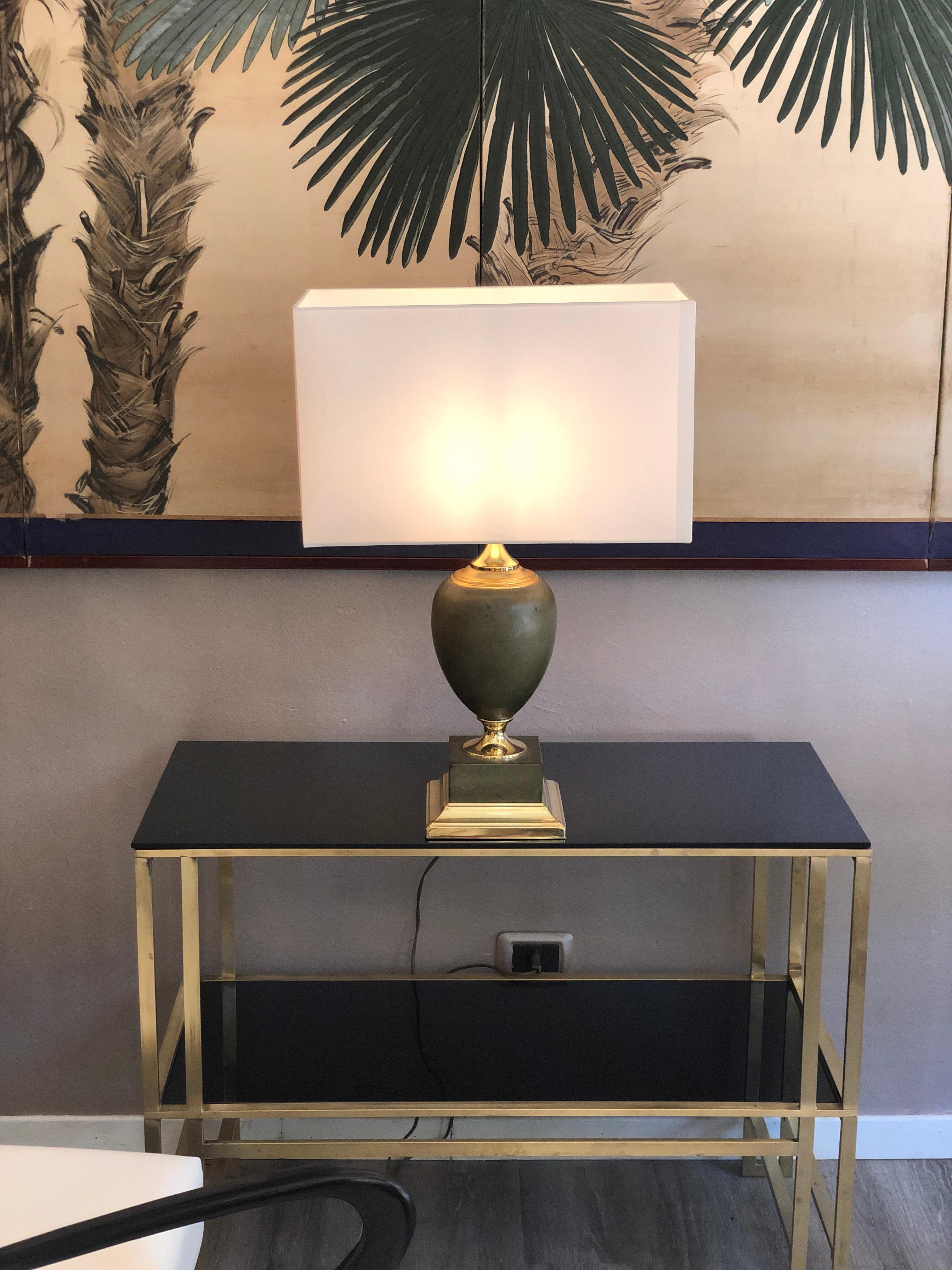 Maison Le Dauphin a pair of Regency leather and brass table lamps 

Maison Le Dauphin - a pair of Regency table lamps signed Le Dauphin. The lamps are made of leather and brass. They are from 1970s from France. 
They are made by Maison Le