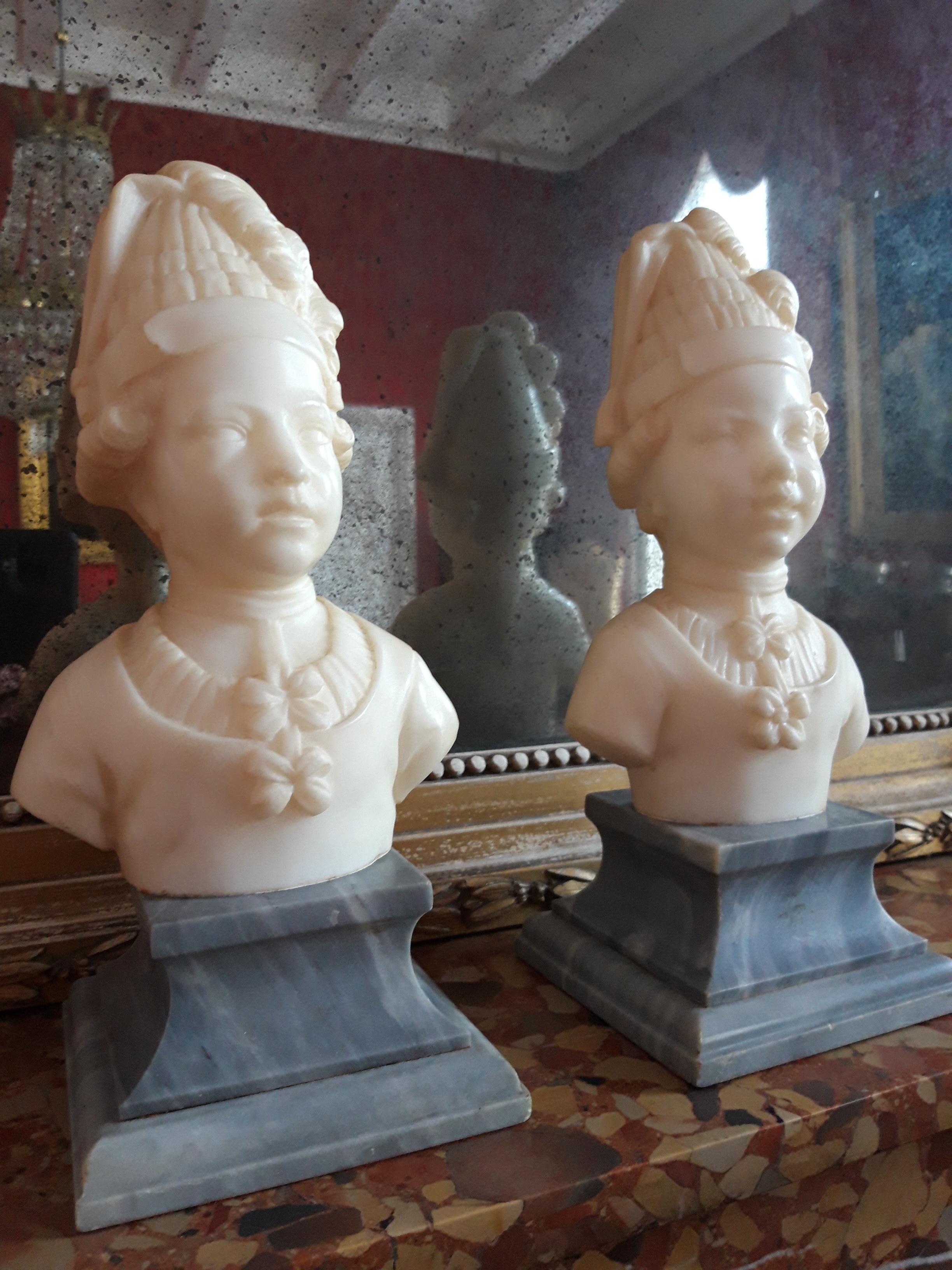 Two finely carved marble child busts. 
On grey marble base. 
Signed. L. Gregoire.
France late 19th century.