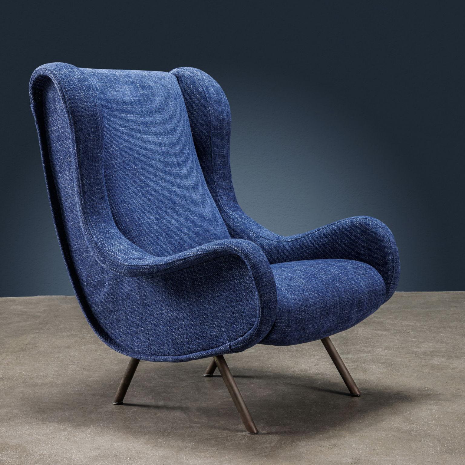 Pair of Senior model bergere armchairs, designed by Marco Zanuso and produced by Arflex starting from 1951. Padded in foam, they have a new fabric covering in shades of blue and white while the legs are in metal and brass.