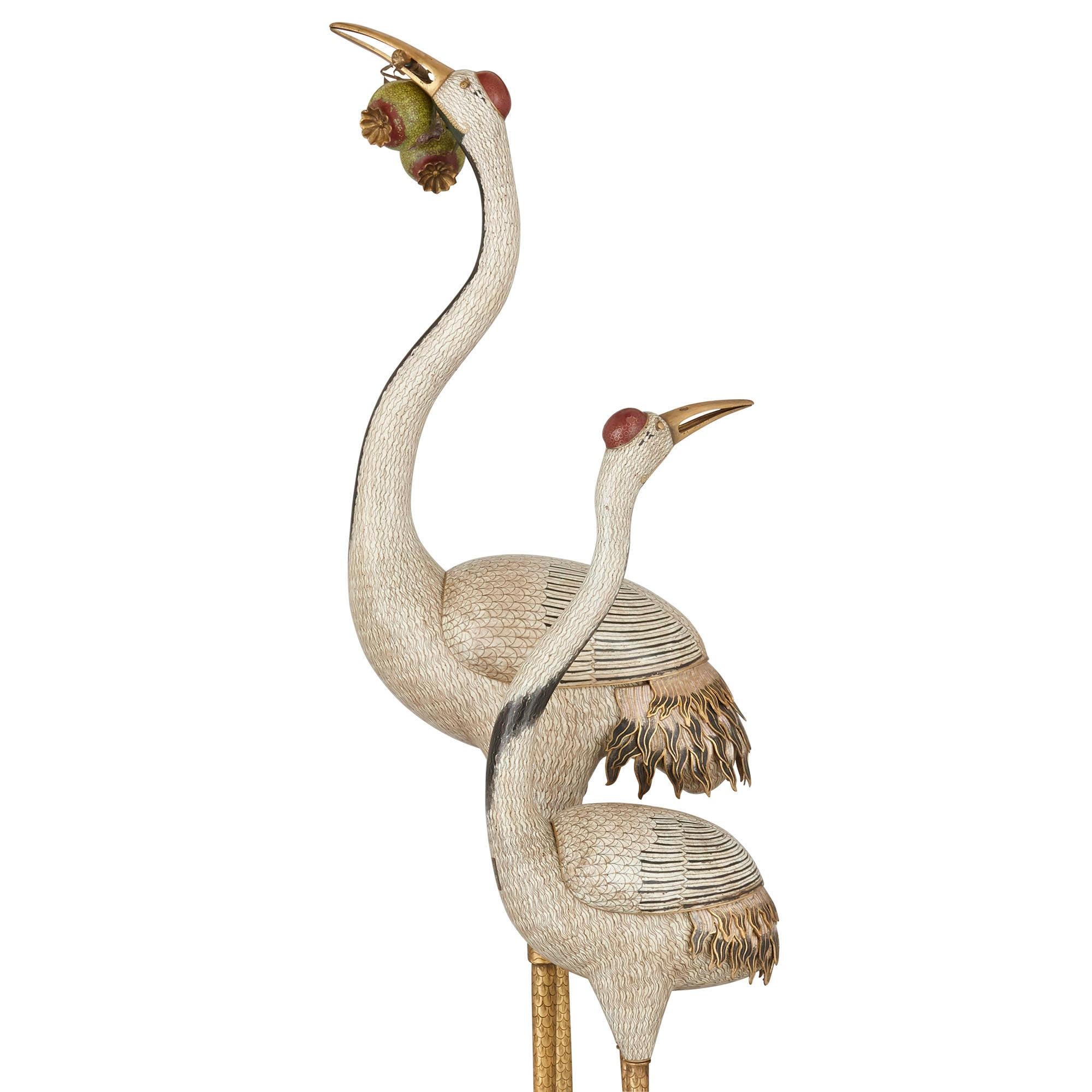 Two massive late Qing cloisonné enamel models of cranes
Chinese, circa 1900
Measures: Height 187cm, width 52cm, depth 50cm

These extraordinary Chinese cloisonné enamel models of cranes are finely and realistically modelled and strikingly large,
