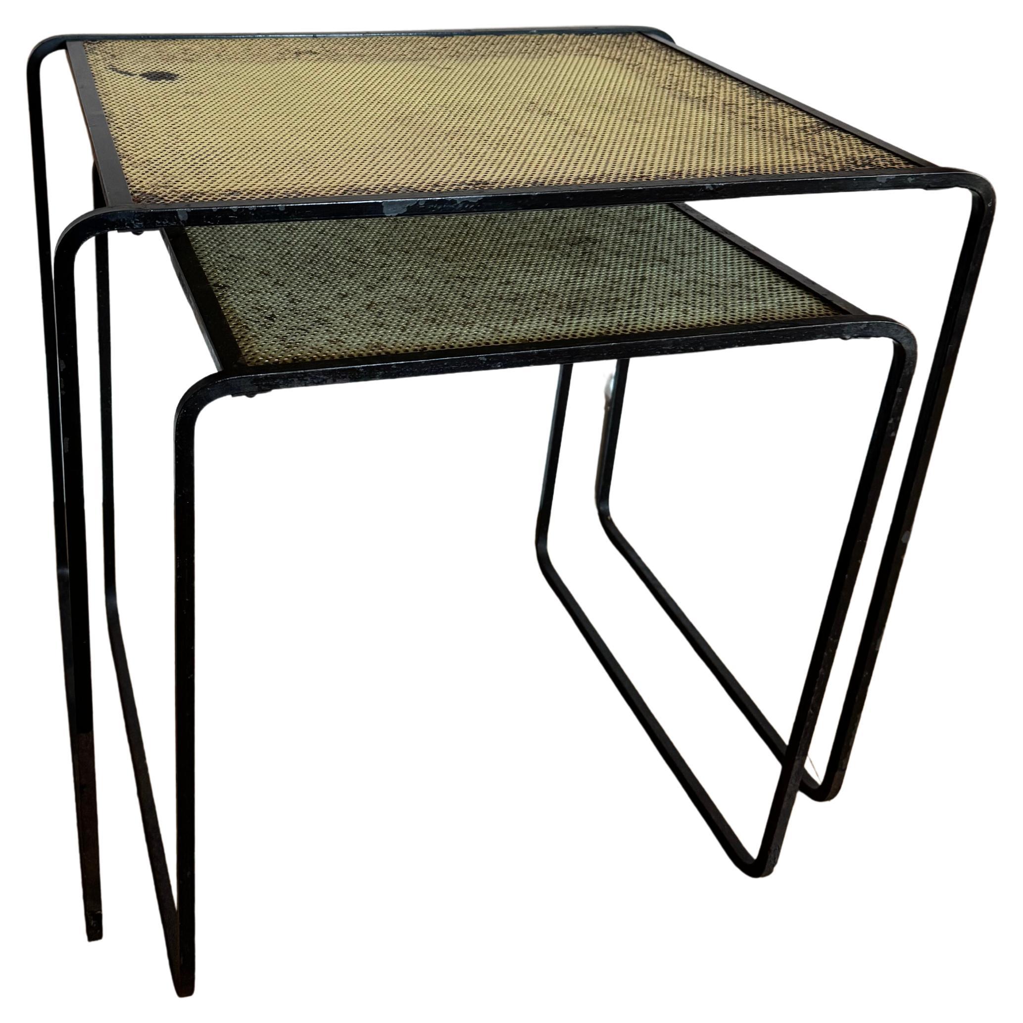 Two Mathieu Mategot style pierced metal side tables.