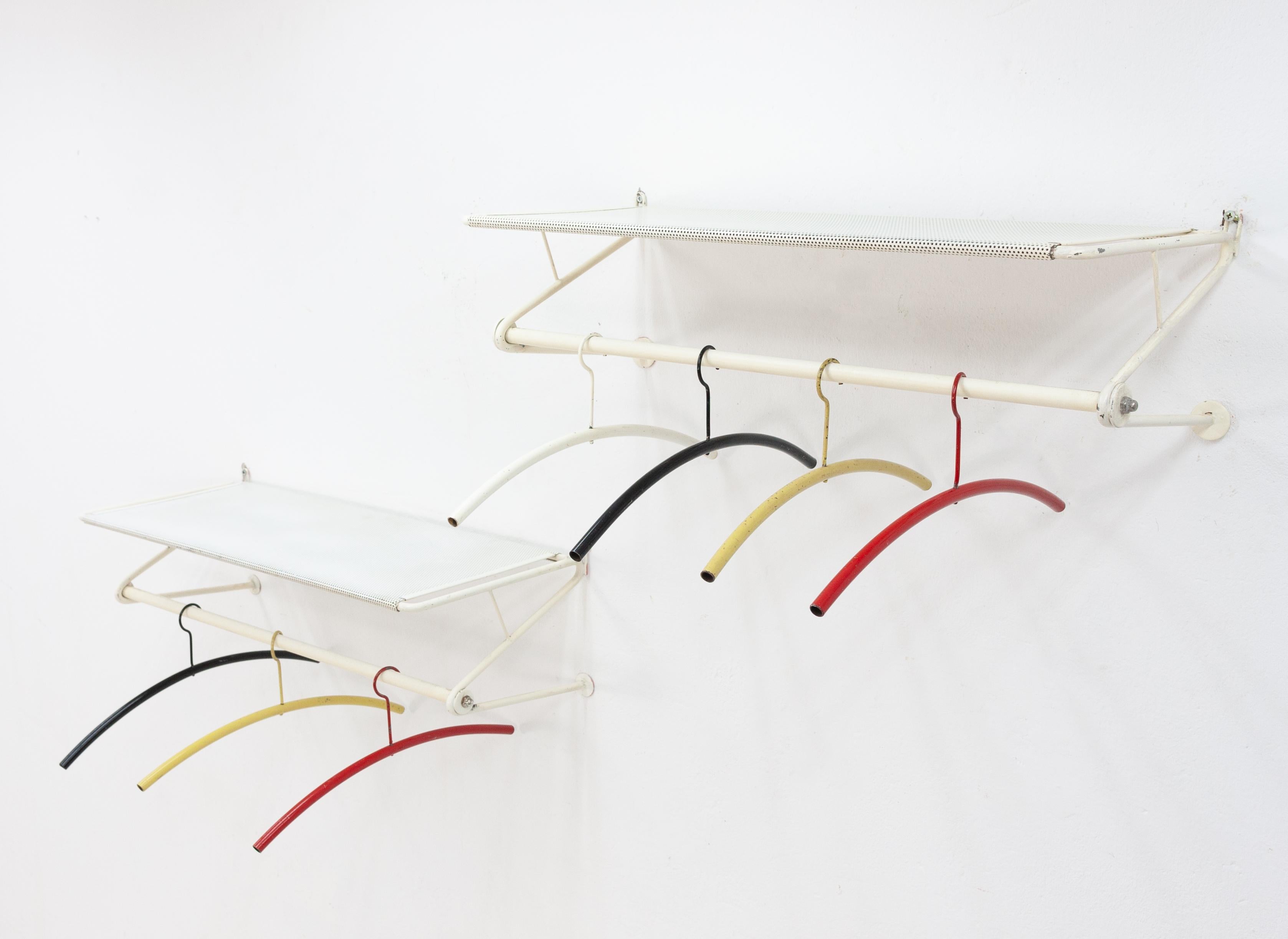 Two wall coatracks. Design Mathieu Mategot for Artimeta Soest. Metal with 7
original coat-hangers.