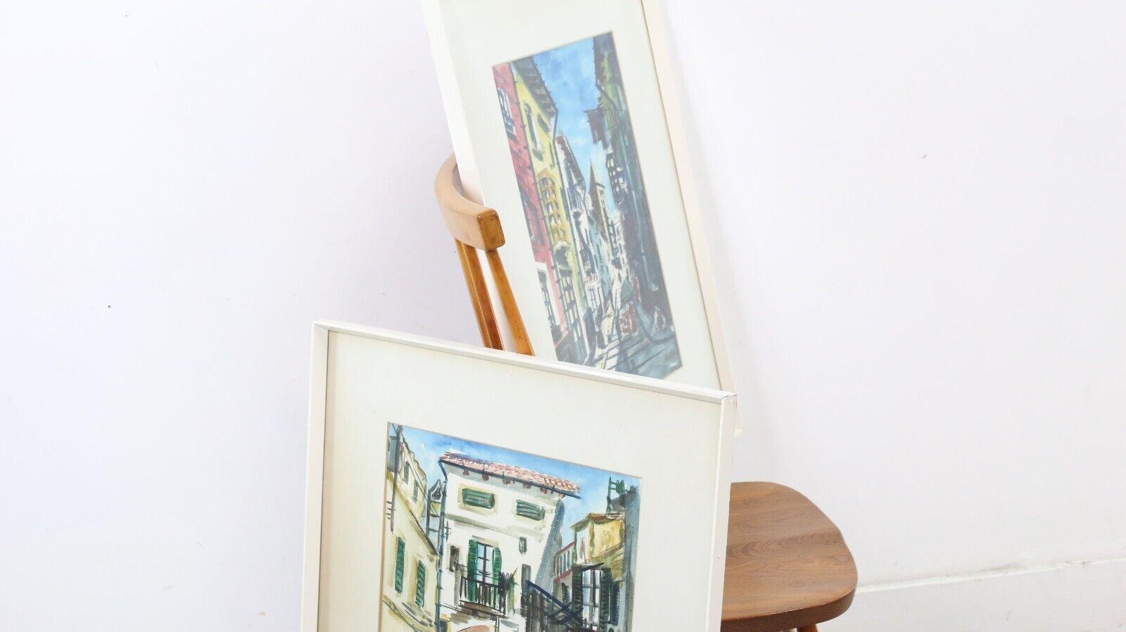 Peinture à l'aquarelle du milieu du siècle

Deux aquarelles originales du milieu des années 1960, encadrées et colorées, dont l'une représente une scène de rue d'un village espagnol.

Signé par l'artiste.

Dimensions (cm) : 

77H x 58W x 3D
73H x
