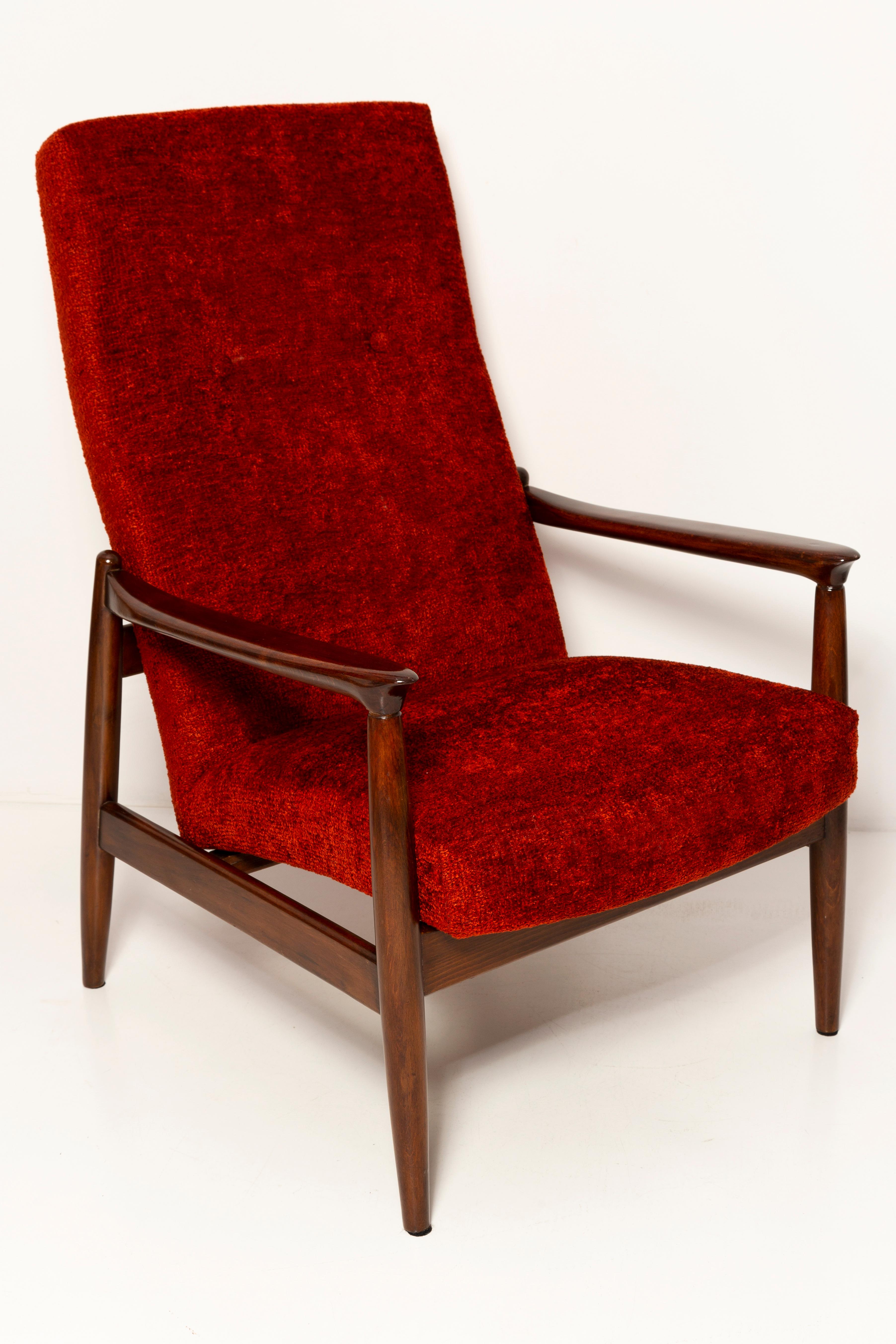 Dark red boucle armchair designed by Edmund Homa, a Polish architect, designer of Industrial Design and interior architecture, professor at the Academy of Fine Arts in Gdansk.

The armchairs were made in the 1960s in the Gosciecinska Furniture