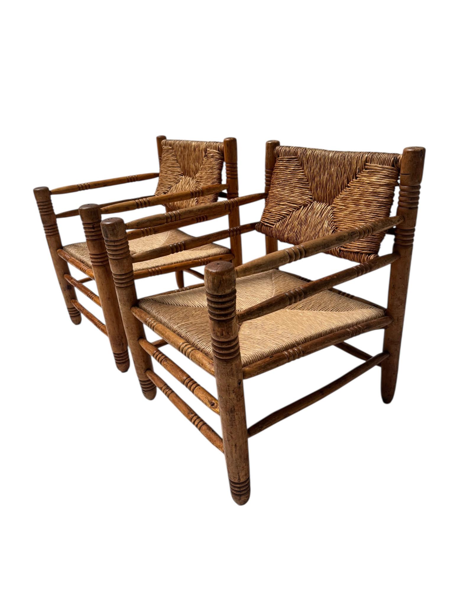 Two Mid-Century Modern Audoux-Minet Style Armchairs, 1950s (Binse) im Angebot