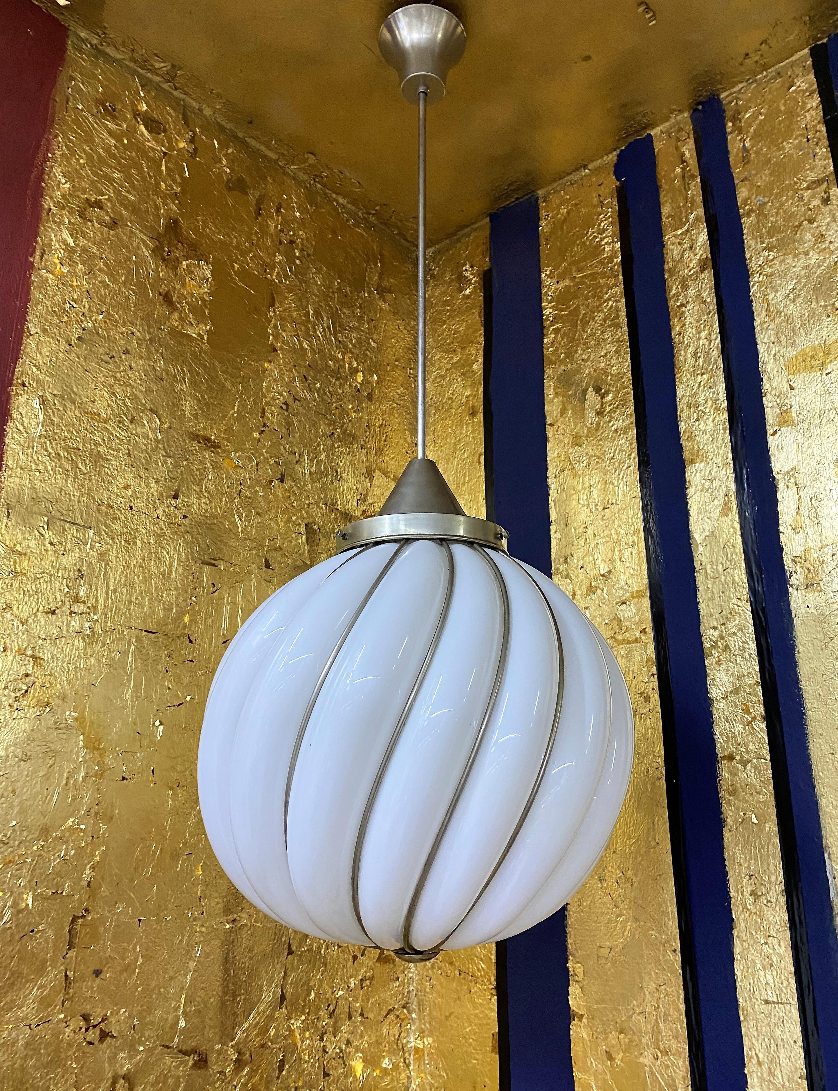 Beautiful pendant lights by VeArt, circa 1970,
This is a re edition based on the design by Adolf Loos as you can observe in the advertising photo,
It is hand blown in opaline glass and 