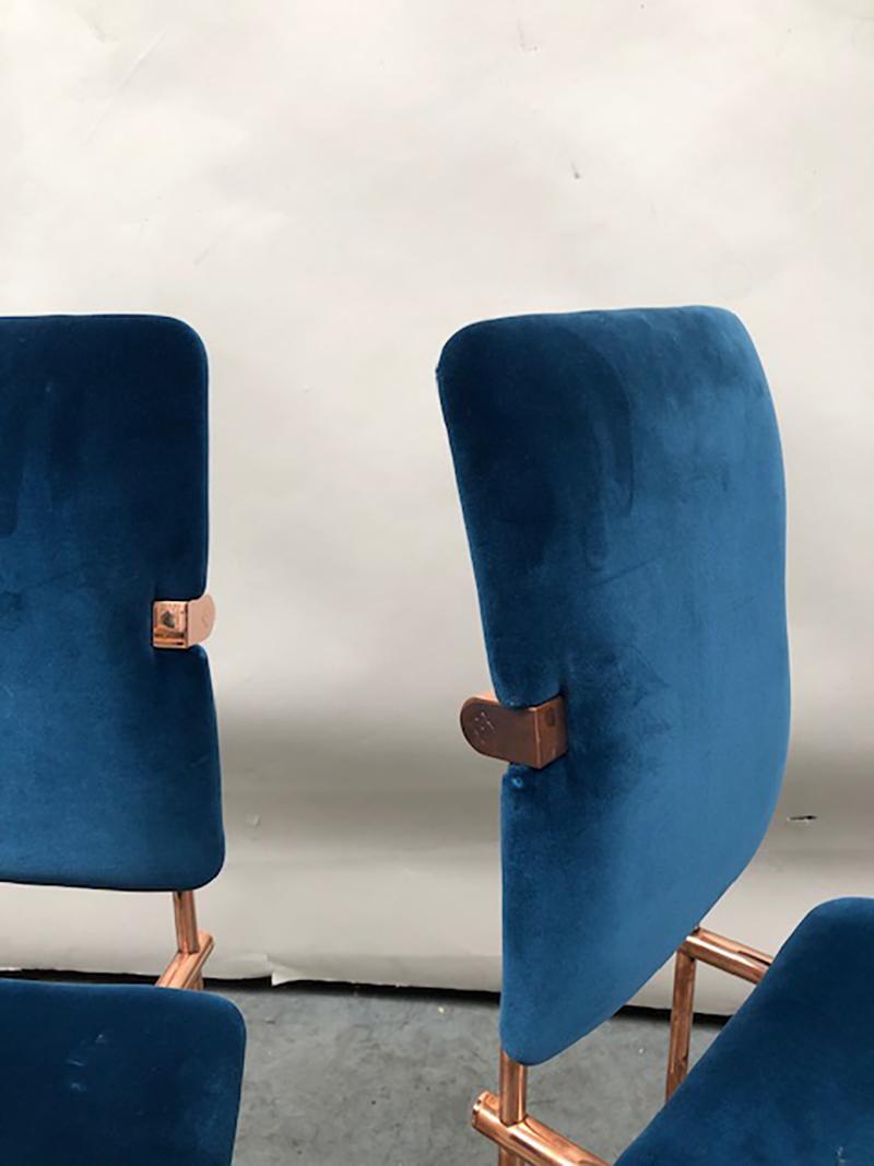These two Jodie S02 Bauhaus style chairs with blue velvet upholstered seating came on the market in 1986 and have remained a leading GHYCZY design ever since. The upholstered blue velvet fabric is from DEDAR Milano. The copper framing is aged and