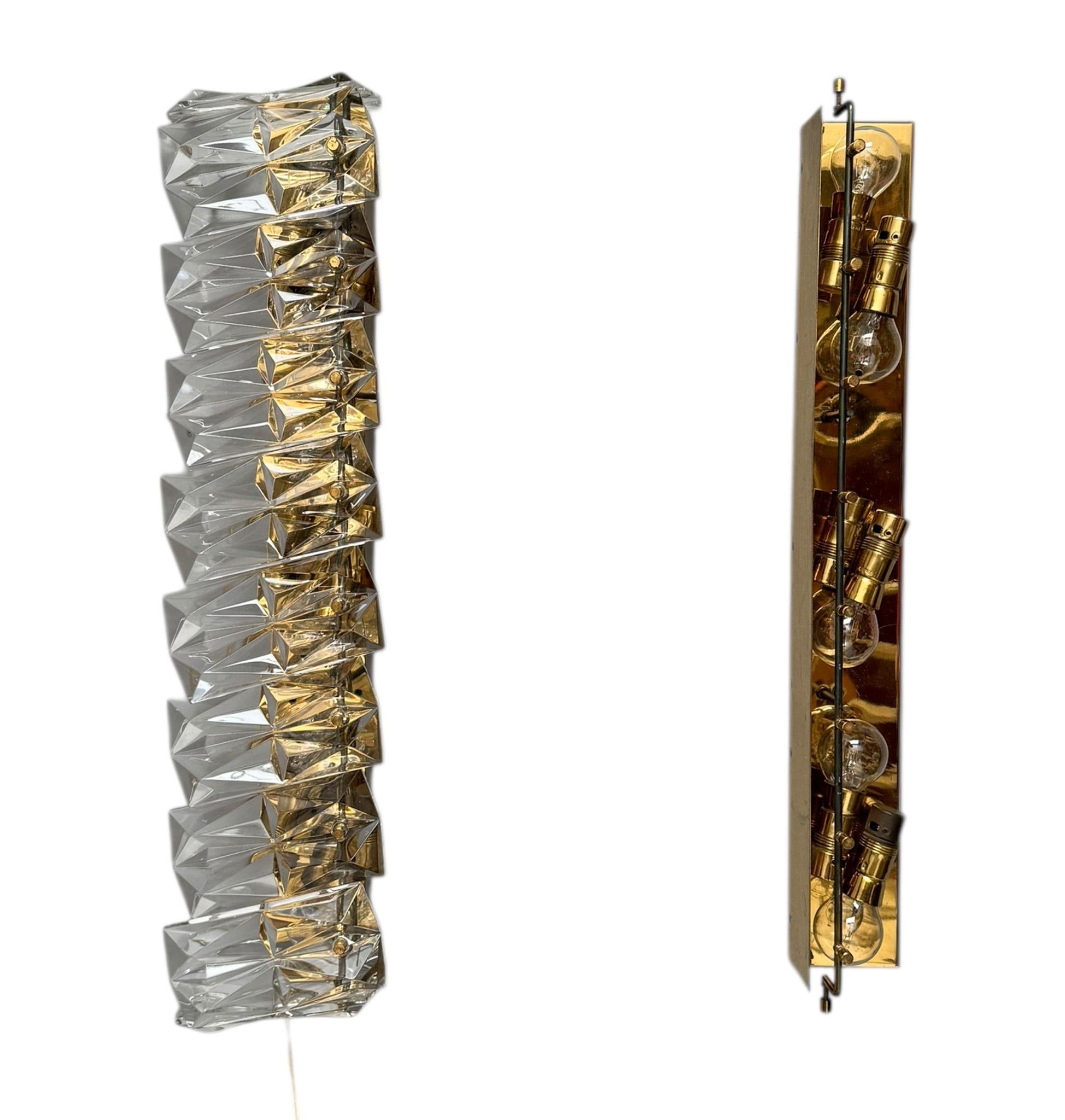 Stunning and elegant pair of Mid-Century Modern wall lights or sconces.
Striking Italian design from the 1960s.
Original brass frames, rewired with six original brass sockets on each frame.
Ten original Murano glass pieces on each wall light or