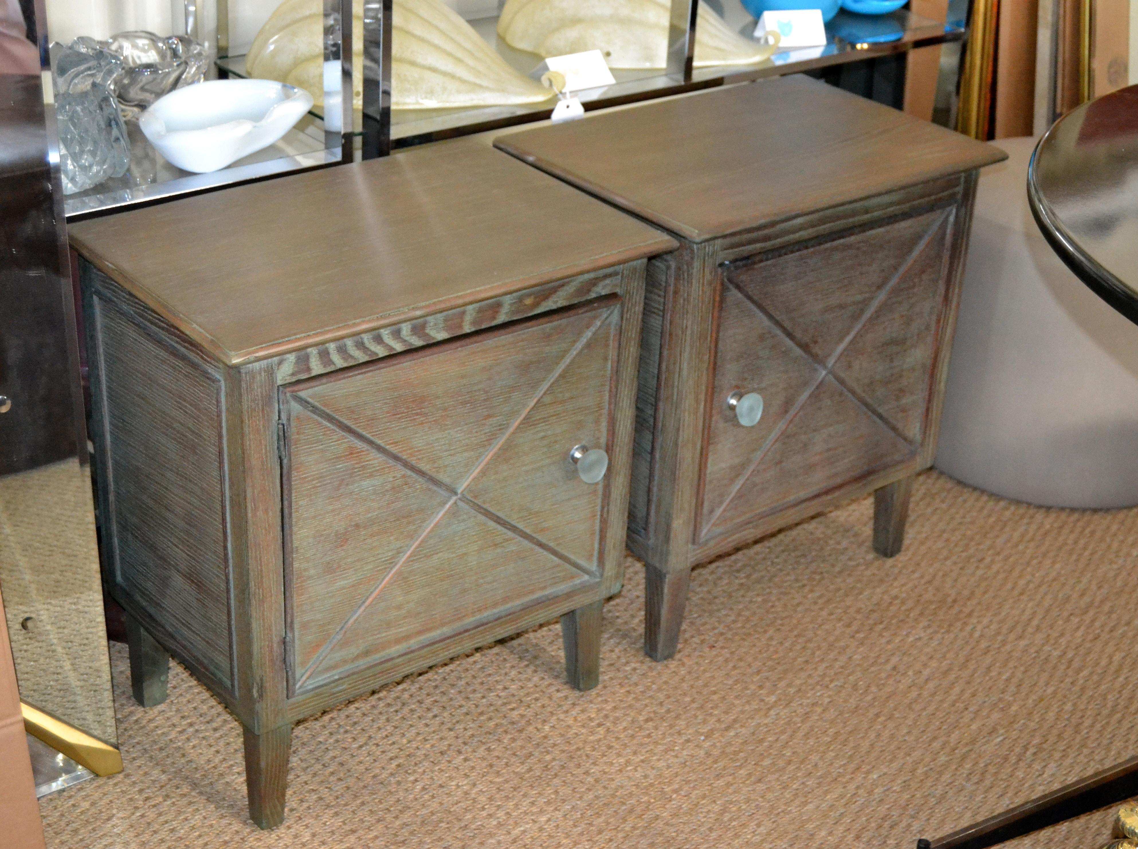 A pair of Mid-Century Modern oak nightstands or bedside tables in gray-turquoise Cerused finish.
The pulls are made out of resin.
Both are the same size and mirror image of each other.


           