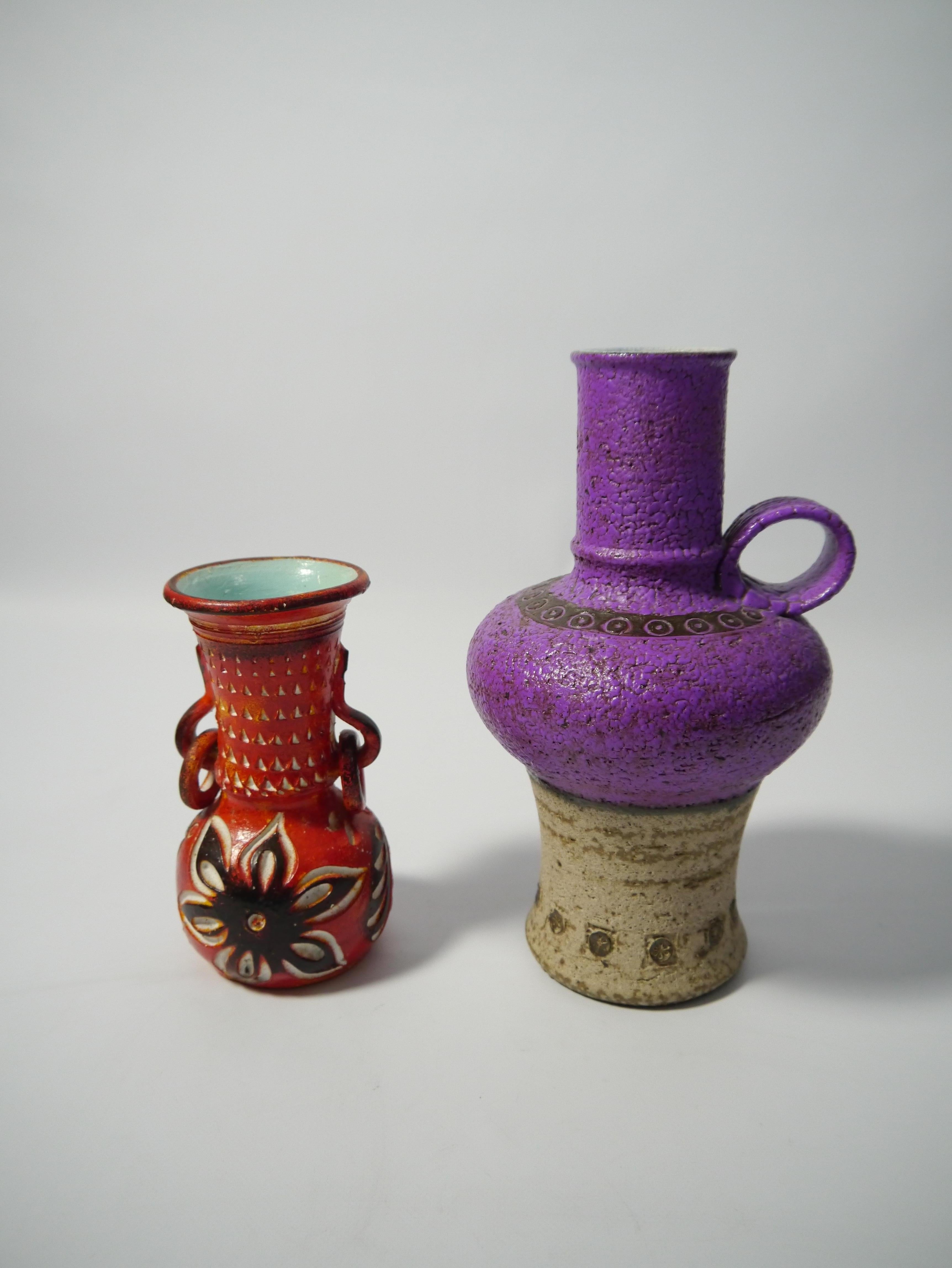 Two eclectic mismatching ceramic vases produced in West Germany, 1960s. The purple vase rather tall.