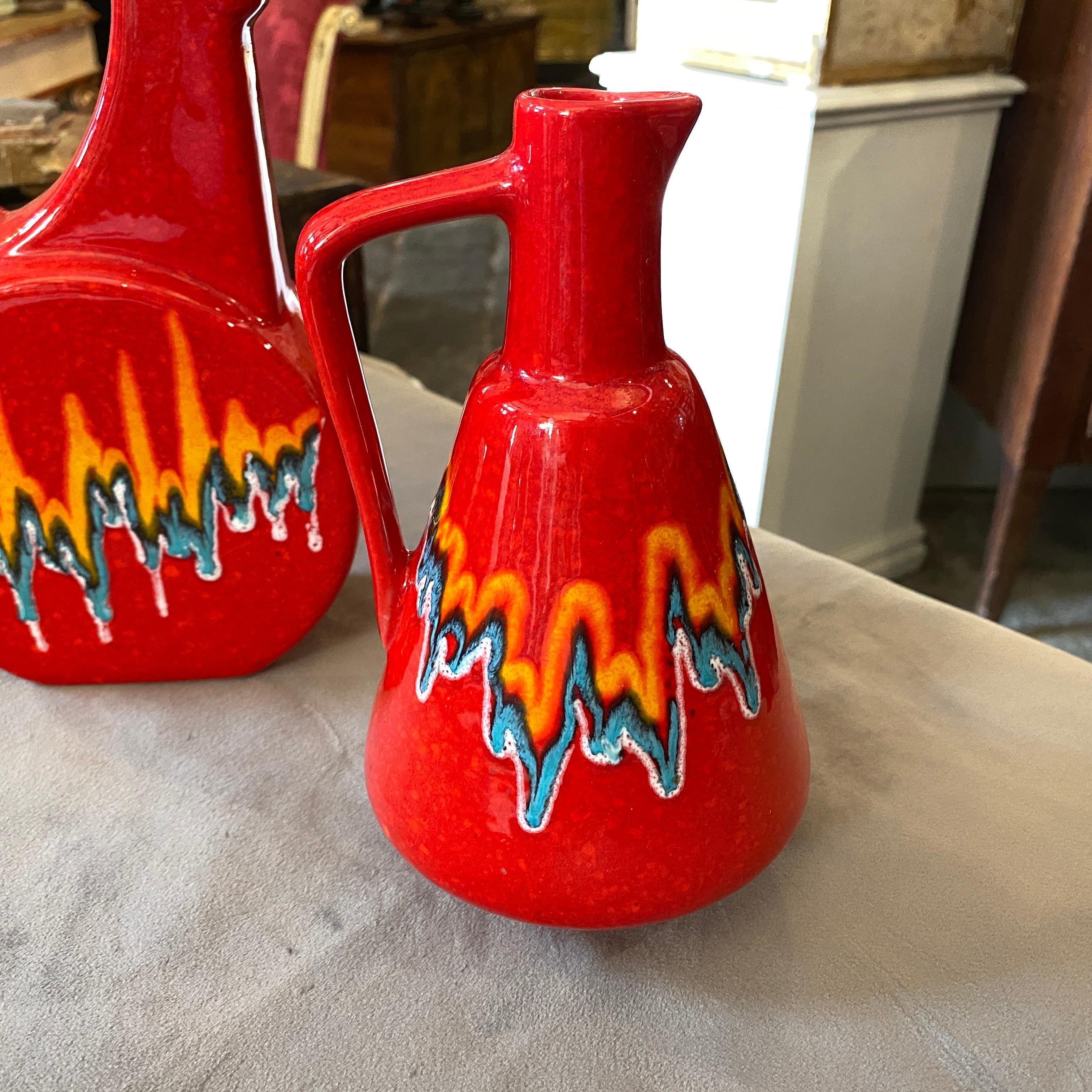 Two ceramic vases by Bertoncello, made in Italy in the early 1980s in Memphis style. Vibrant colors are in perfect conditions. They are signed with number on the bottom as Bertoncello usual did.