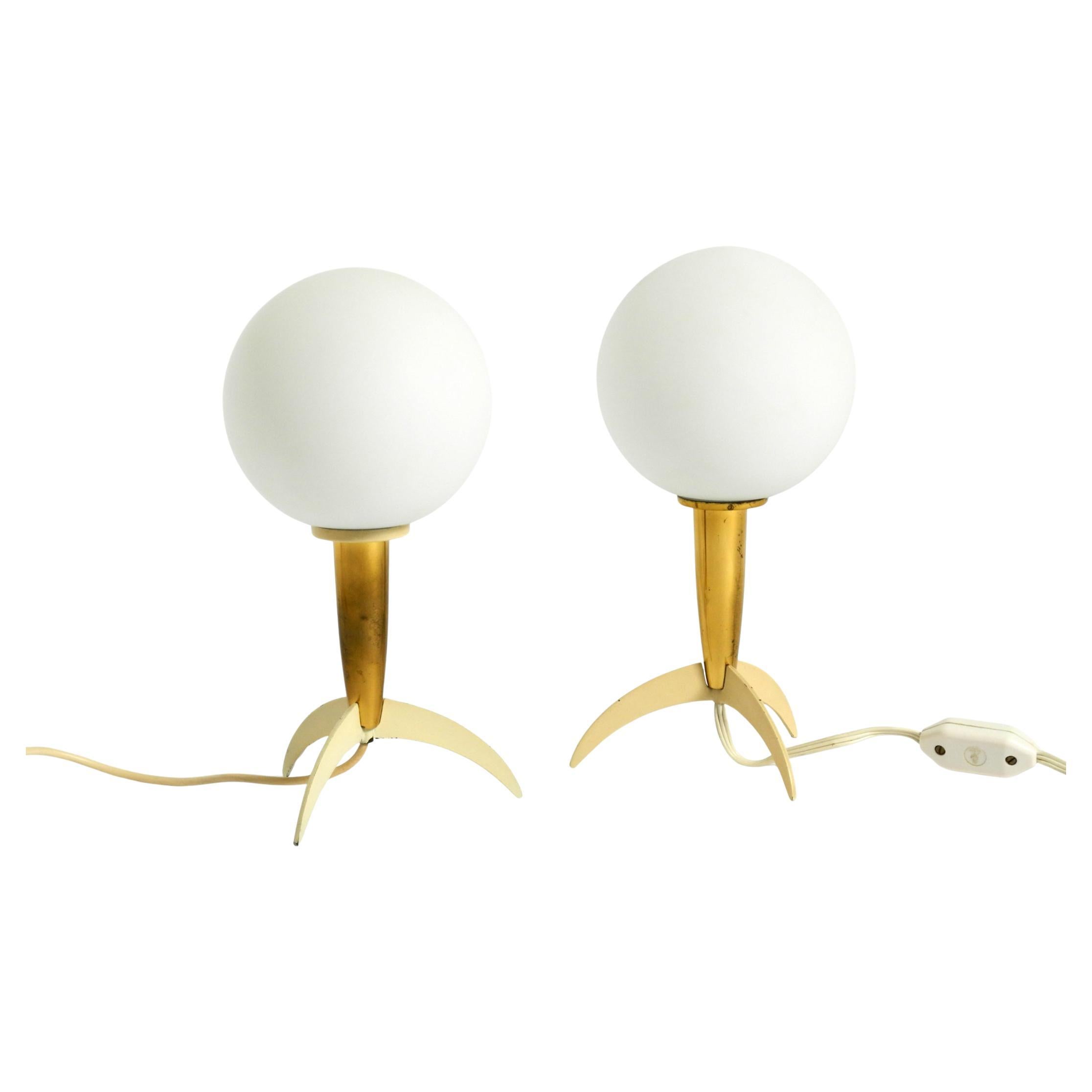 Two Mid-Century Modern rocket table lamps in brass and glass