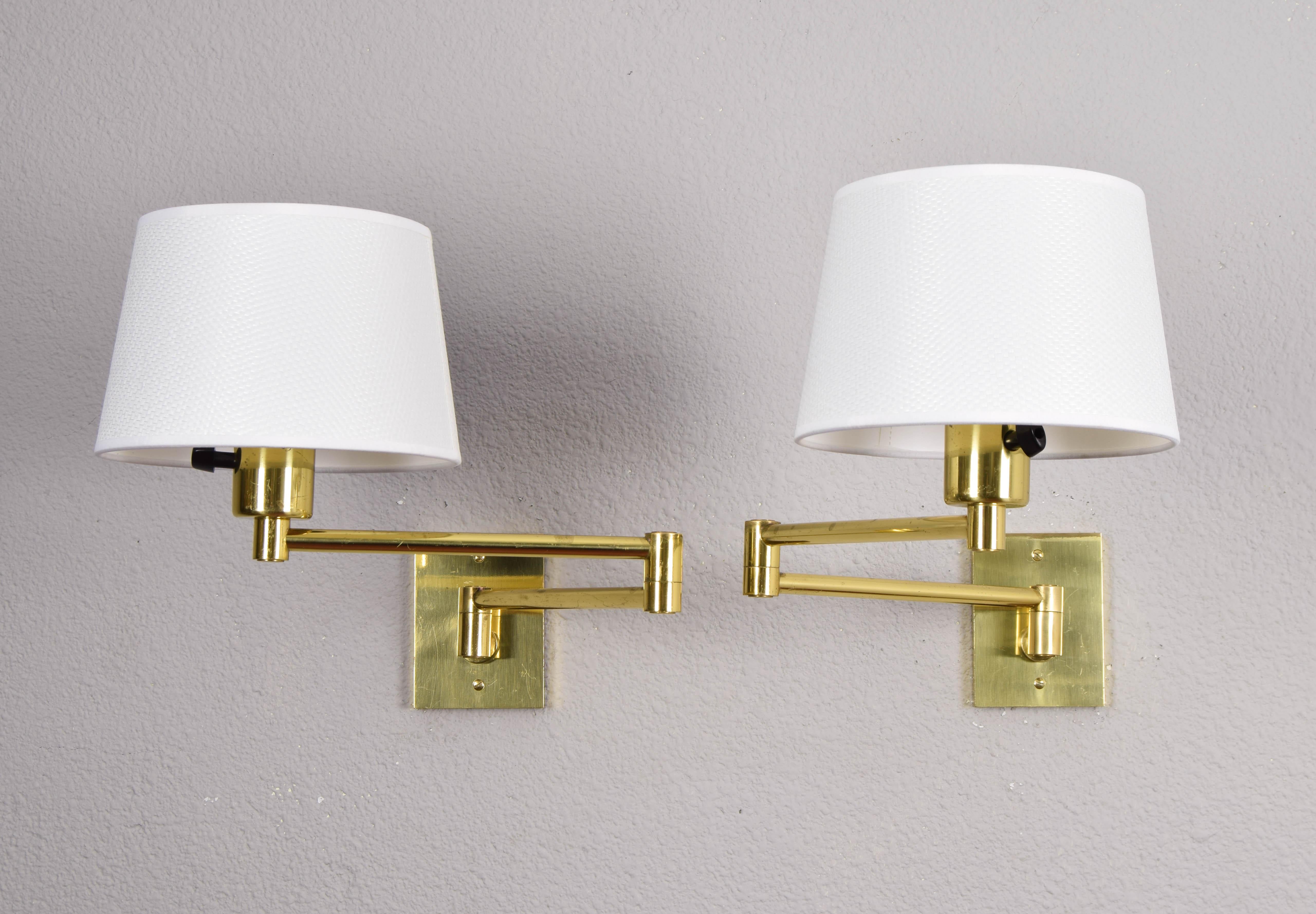 Pair of wall lamps designed by George W. Hansen in the 1960s and produced by the Spanish firm Metalarte with permission from Hansen Lamps New York in the 1970s. Brass structure and articulated arm.
The brass has areas of wear and scratches as can be