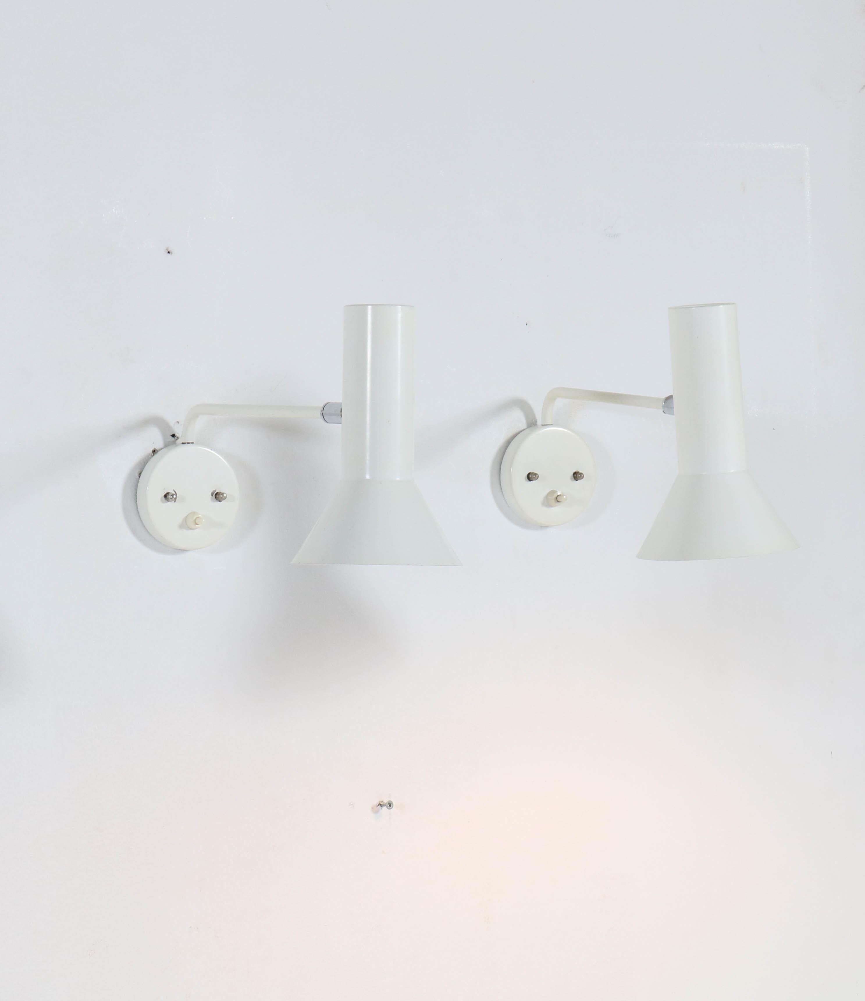 Wonderful pair of Mid-Century Modern wall lights or sconces.
Design by RAAK, Amsterdam.
Striking Dutch design from the 1920s.
White lacquered metal with chrome details.
In good original condition with minor wear consistent with age and