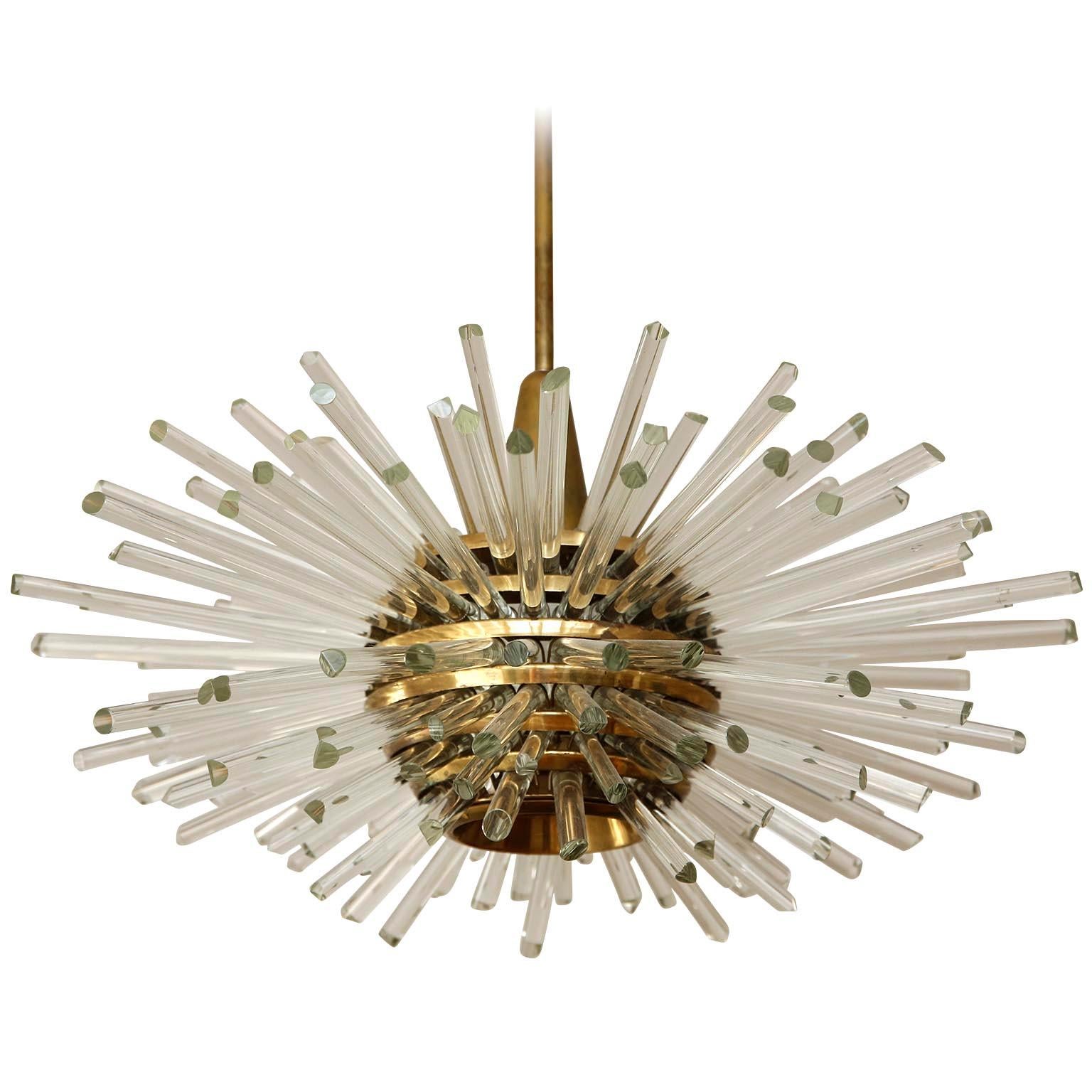 Only one light is available!
One of two fantastic Sputnik chandeliers by Bakalowits & Sohne, Austria, manufactured in midcentury (late 1960s or early 1970s). A layered multi-tier structure made of solid brass rings and glass rods with faceted ends