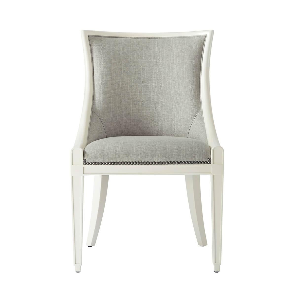 lacquered in an ivory finish, upholstered in a performance fabric is with curved scoop padded backrest, above a tight upholstered seat, raised on tapered legs, and finished with antiqued steel nailheads.

Dimensions: 21