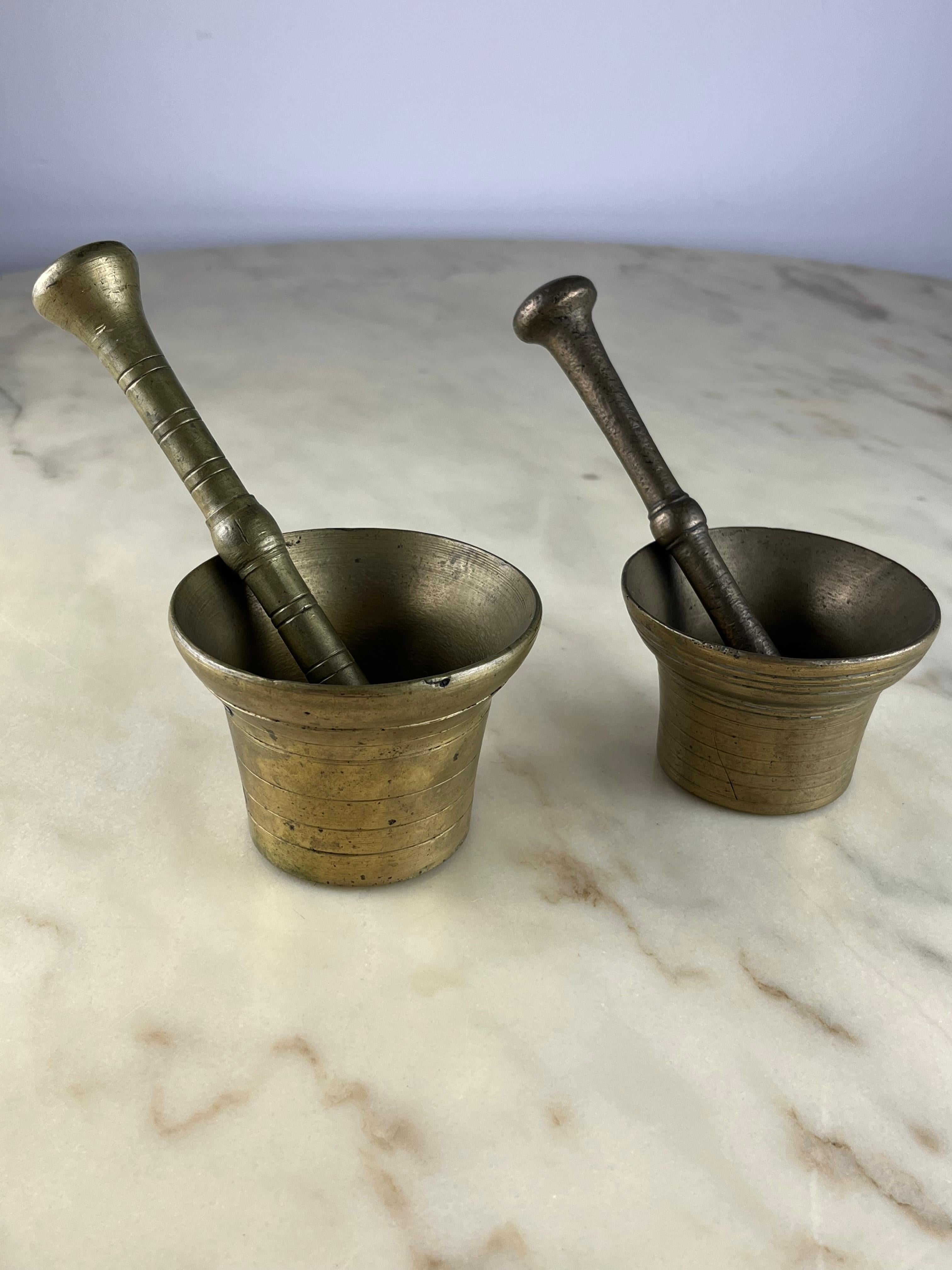 Two mortars with pestles, brass, Genoese 