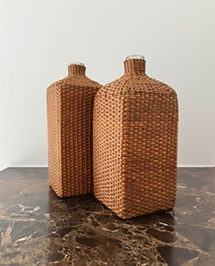 Two Mouth-Blown Glass Wine Bottles in Rattan Basket Cage, France circa 1900th