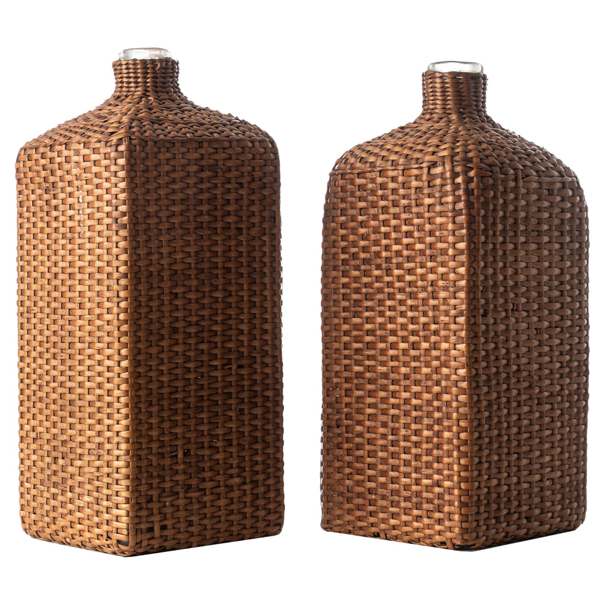 Two Mouth-Blown Glass Wine Bottles in Rattan Basket Cage, France circa 1900th