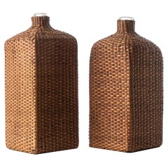Two Mouth-Blown Glass Wine Bottles in Rattan Basket Cage, France circa 1900th