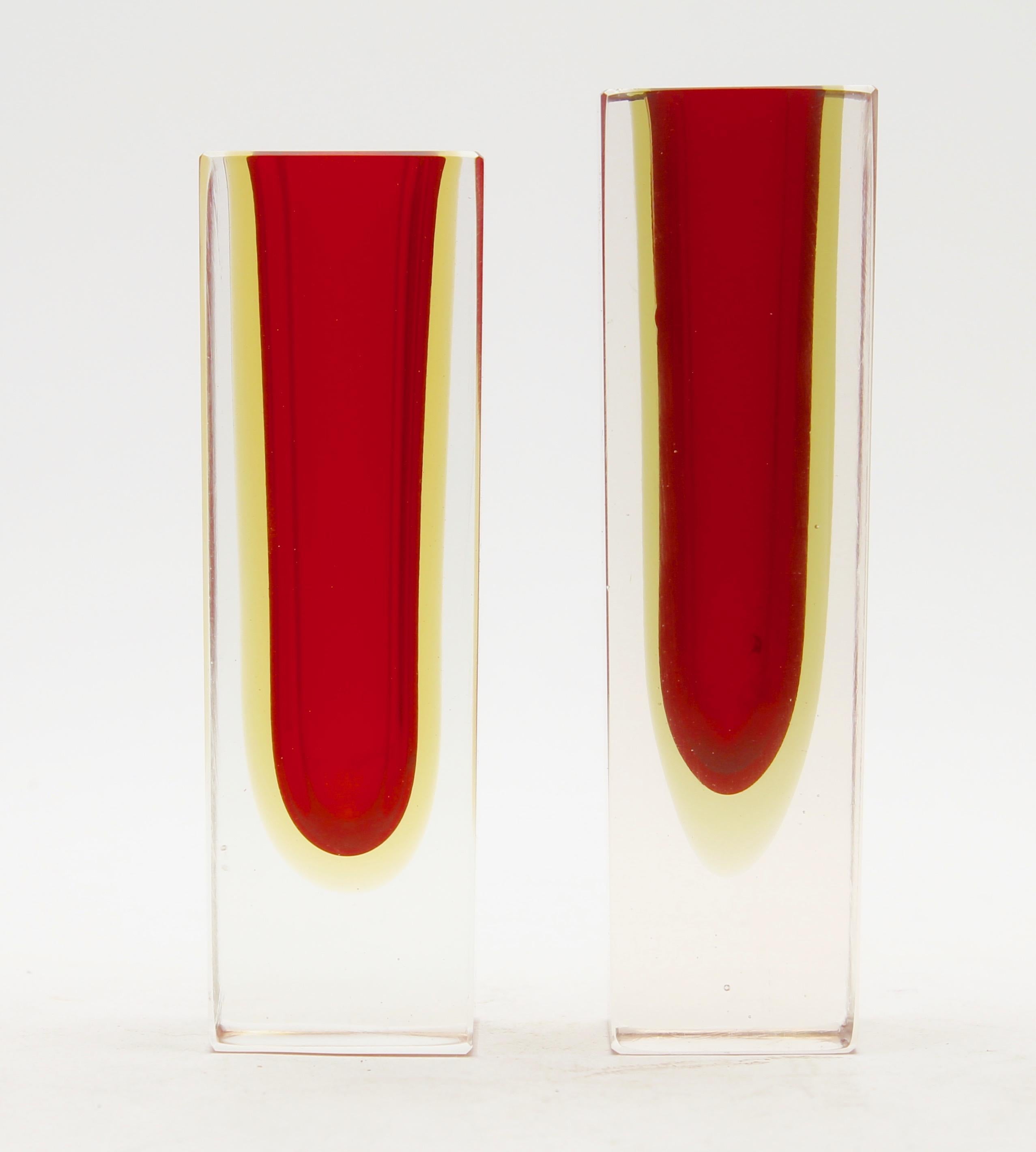 Two similar block vases after the design by Flavio Poli for Mandruzzato, each with a diffused amber color around the red core.
This iconic Murano design takes a Minimalist approach to glass design and turns the focus to the skills of the master
