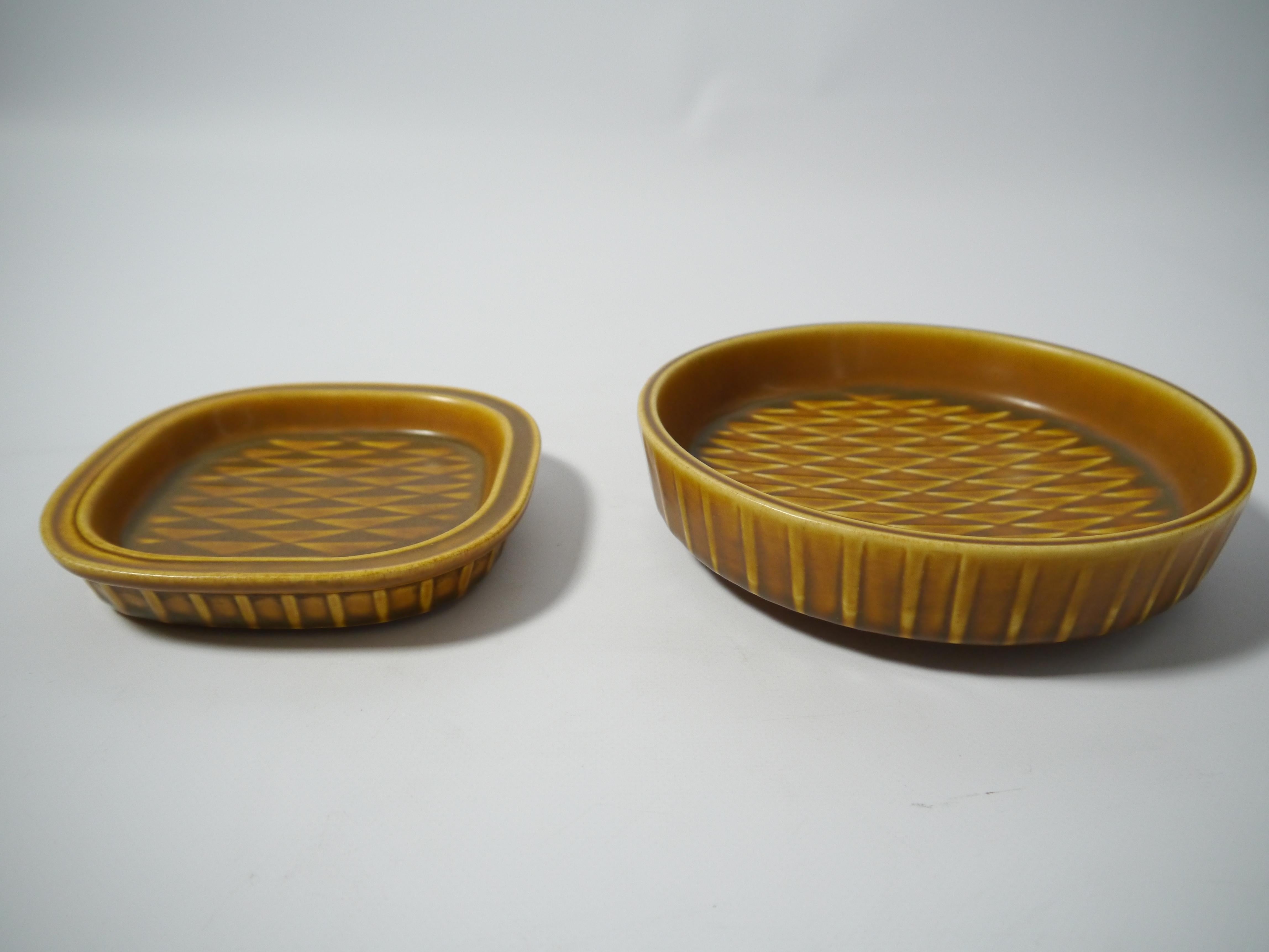 Two ceramic plates from the Eterna series, designed by Gunnar Nylund and fabricated by Rörstrand.