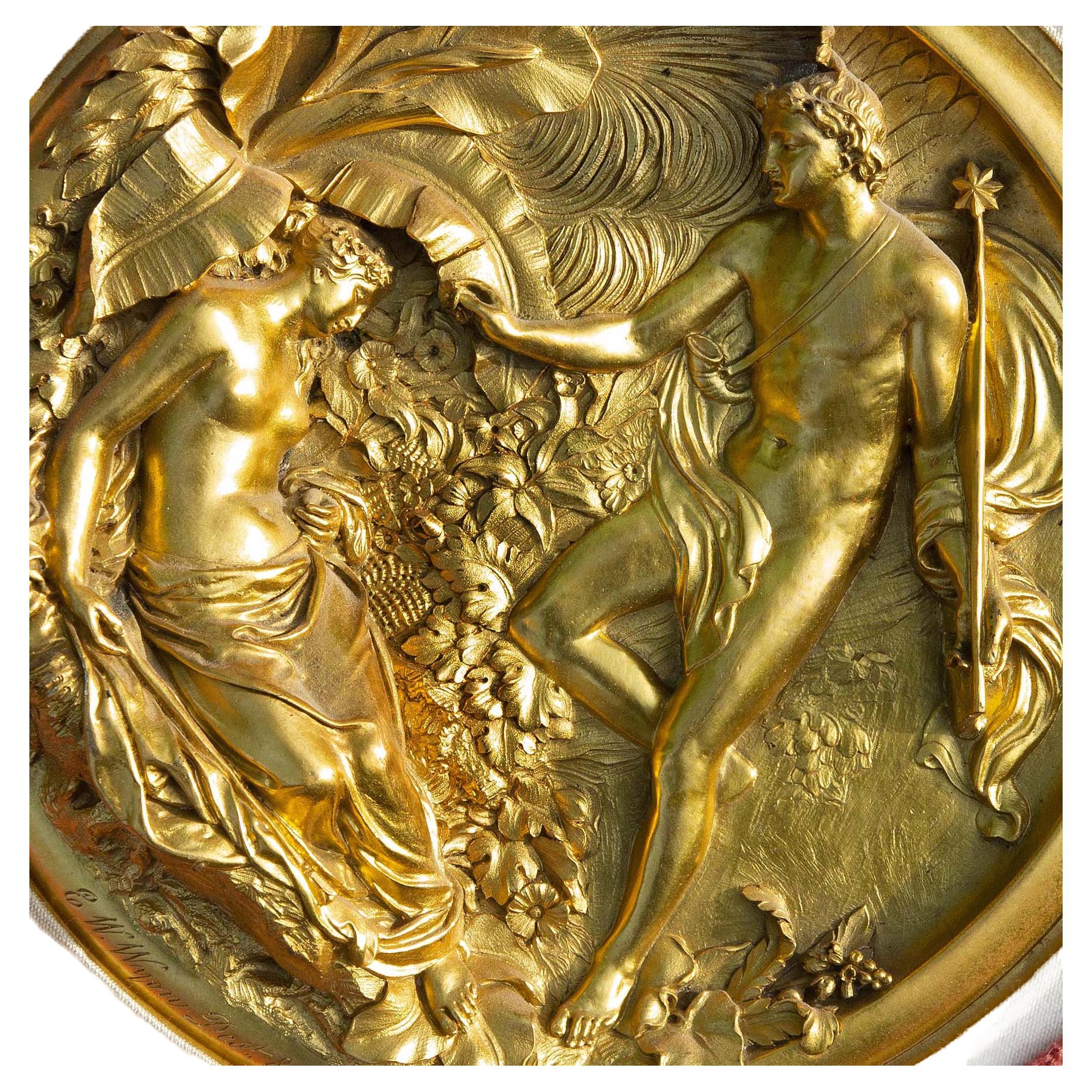 Two fire gilded bronze mythological plaques. Sculpted by Edward William Wygon. Exceptional gilding and detail. Each engraved with the artists name and date. Dated 1848 and 1849. One is framed in a velvet mat. Each plaque measures 7.5